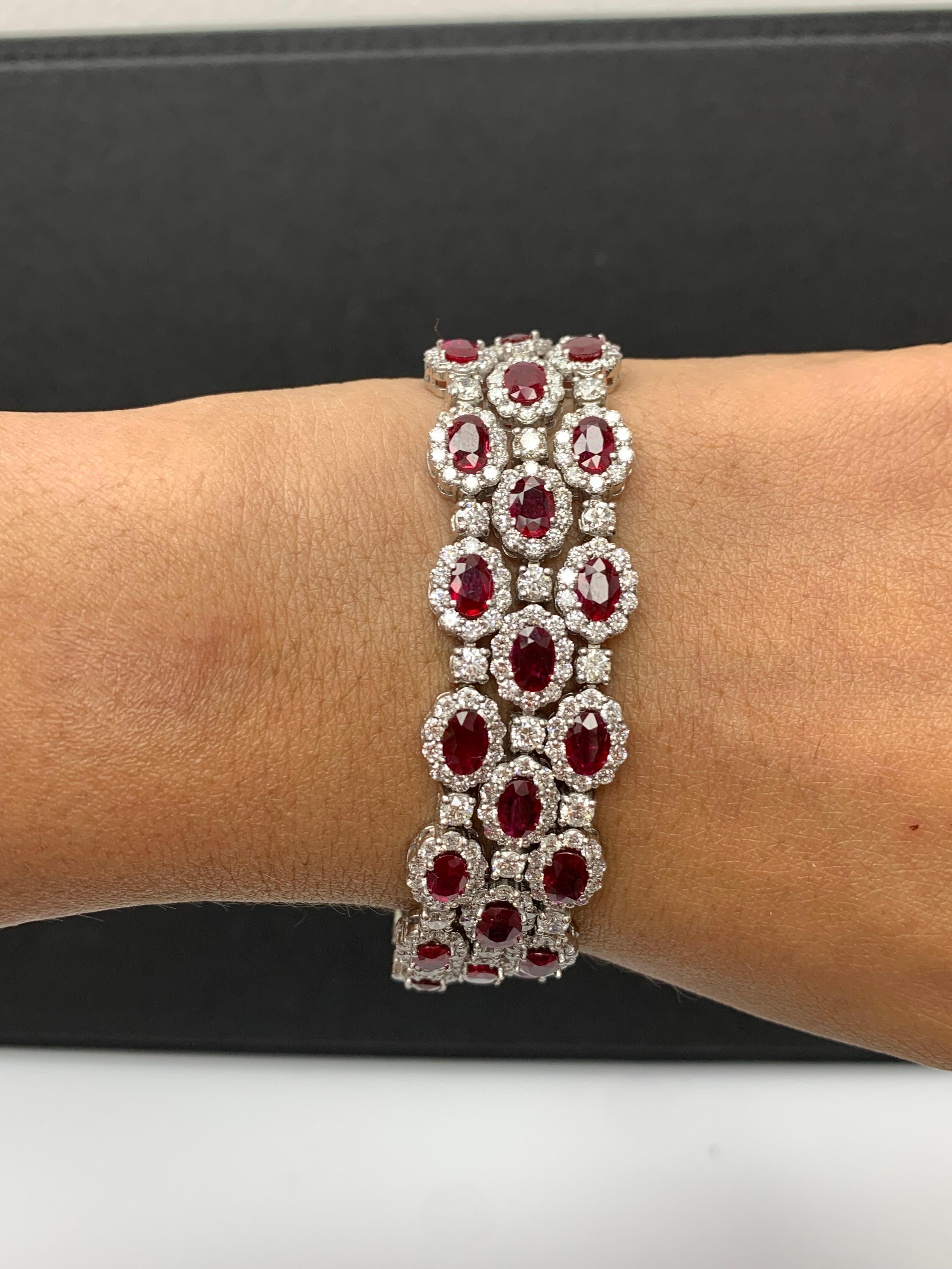 A beautiful Ruby and Diamond 3-row bracelet showcasing color-rich Rubies, surrounded by a single row of brilliant round diamonds. 42 Oval cut lush red rubies weigh 18.01 carats total; 420 accent diamonds weigh 16.44 carats total. Made in 14k white