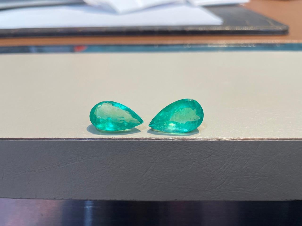 Introducing a breathtaking pear-shaped Colombian emerald, weighing an impressive 18.02 carats. Renowned for its vibrant green hue and exceptional clarity, this exquisite gemstone captures the essence of natural beauty. The elegant pear shape