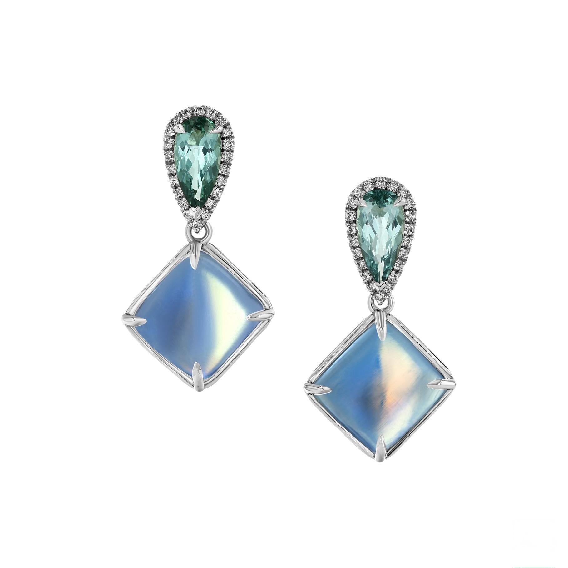 18.02 carats of soothing rainbow Moonstones are paired with 1.40 carats of lagoon Tourmalines, and 0.28 carats of white diamonds in 18K white gold earrings. 