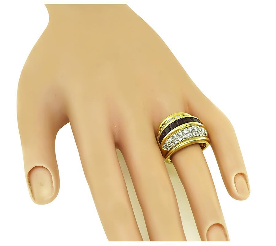 This is an elegant 18k yellow and white gold ring. The ring is set with lovely square cut Burma rubies that weigh approximately 1.80ct. The rubies are accentuated by sparkling round cut diamonds that weigh approximately 1.25ct. The color of these