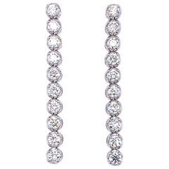 Boucles d'oreilles pendantes en or blanc 18k avec 1,80ct de diamant