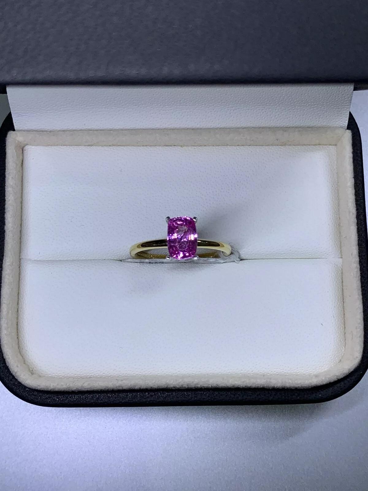 1.80ct Pink Sapphire emerald engagement ring 18ct yellow gold.

Gorgeous pink sapphire gemstone natural untreated emerald / cushion elongated cut in 18ct yellow gold band with white gold claw.

Hallmarked.

The ring can be resized

Box and valuation