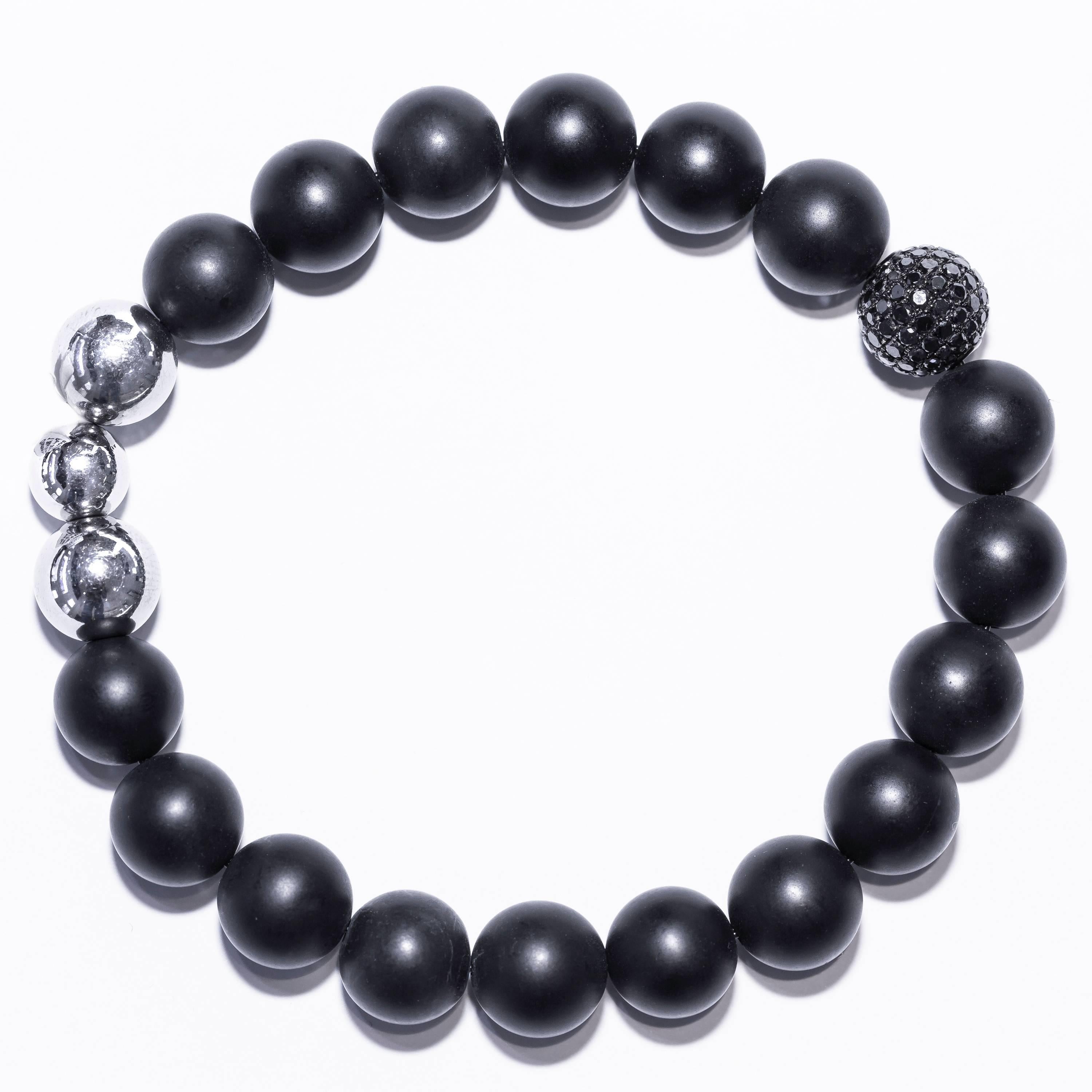 This Bracelet from features one Pave set diamond bead in 18 Karat White Gold, 3 stainless steel beads and 17 matte Black satin agate beads. Size will fit from 7.00 to 8.50 inches (17.78 cm to 21.59 cm). Contemporary and trendy bracelet suitable for