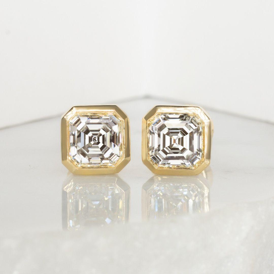 A gorgeous and very high quality 1.80ctw matched pair of asscher cut diamonds has white H color, excellent VS1 clarity and a bright and lively cut! The diamonds are certified by GIA, the world’s premiere gemological authority. 

Under GIA’s rigorous