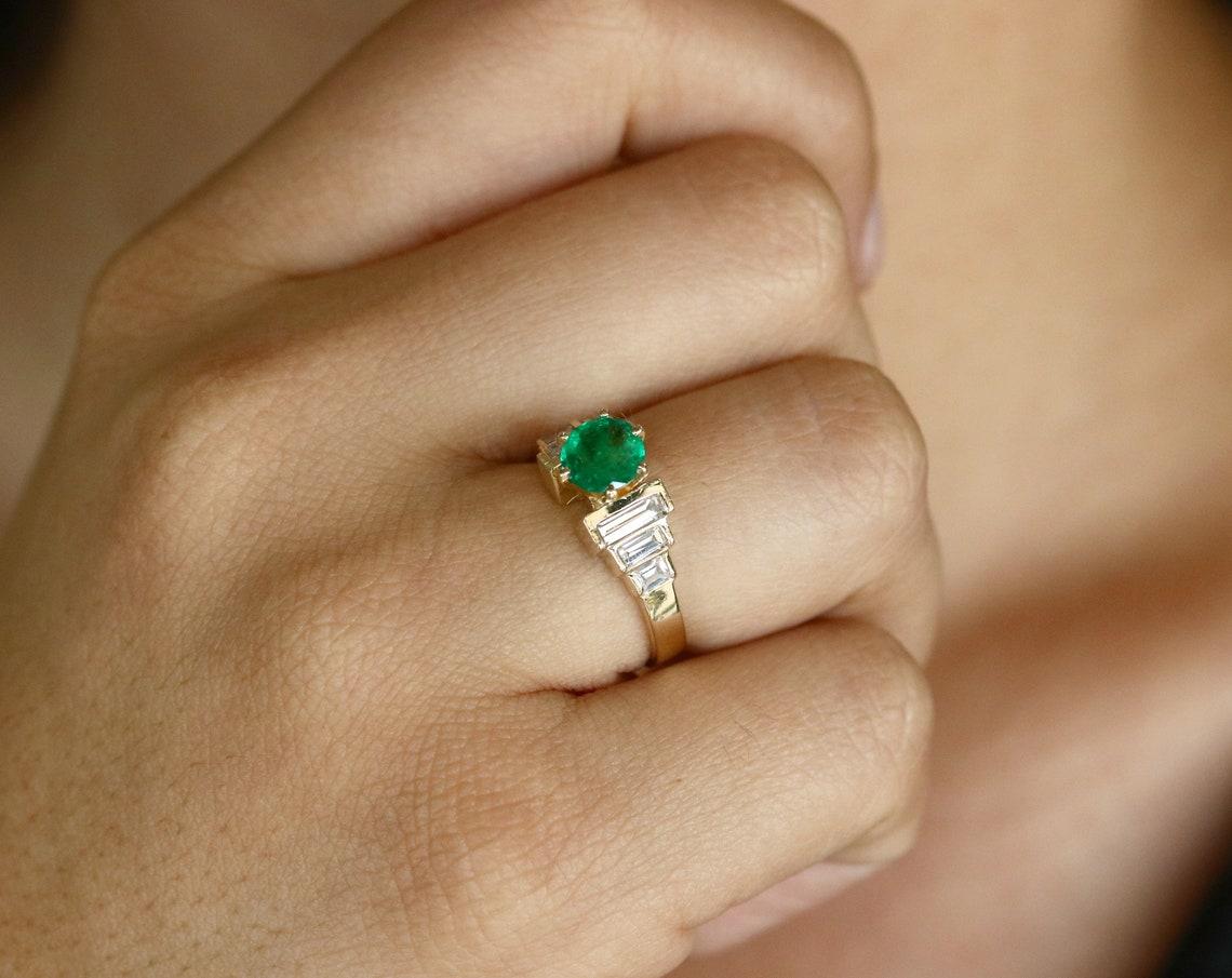 Modern 1.80tcw 14K Round Colombian Emerald & Diamond Baguette Accent Gold Ring For Sale