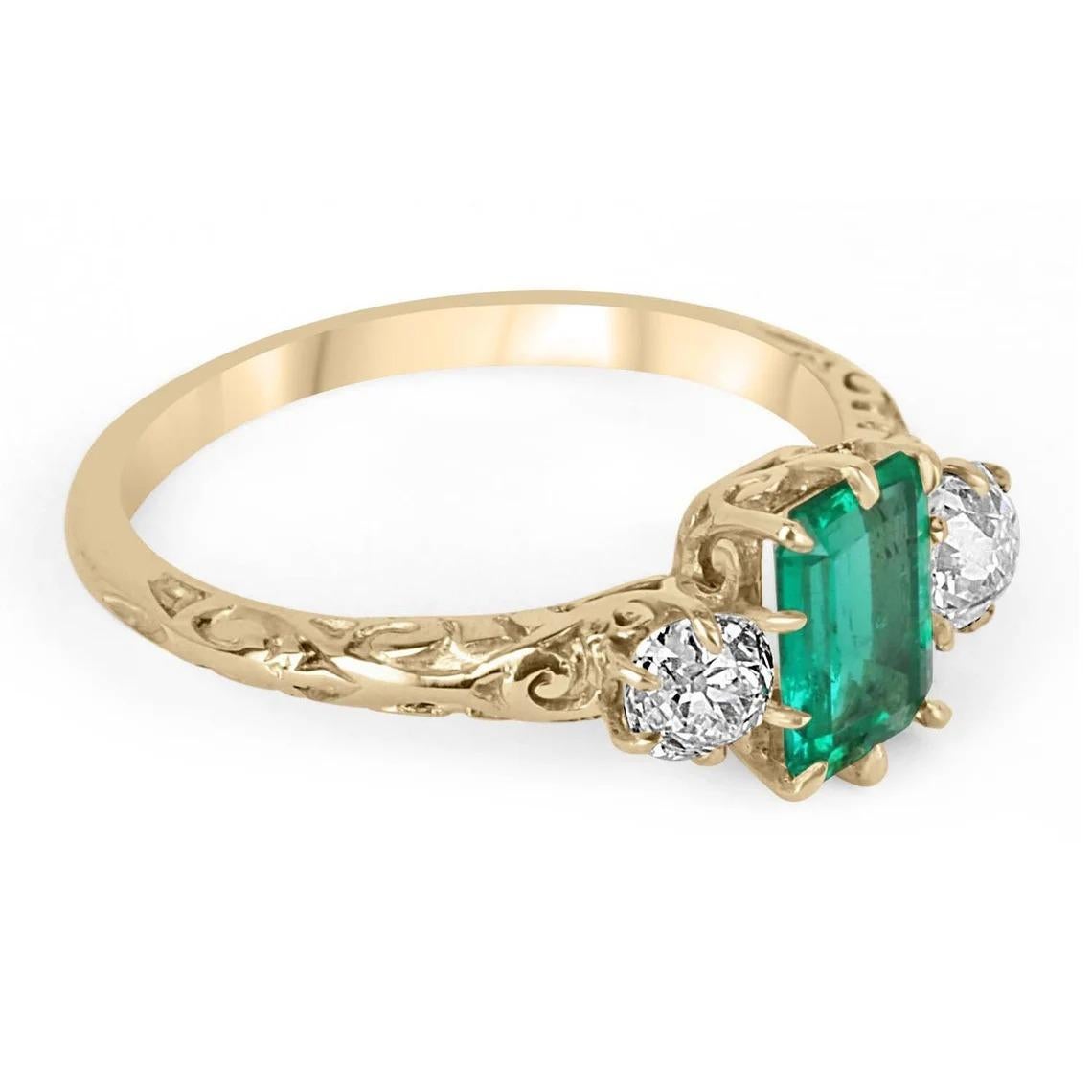 A rare find, a Colombian emerald and old European cut diamond three stone. An extraordinary, Victorian-inspired ring. Dexterously crafted in gleaming 18K yellow, this ring features a high quality, 1.0-carat natural Colombian emerald, emerald cut