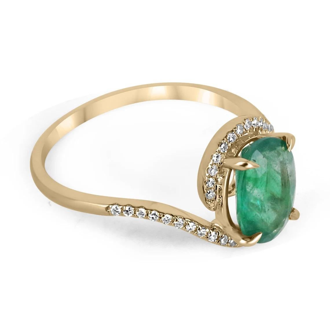 A beautiful, oval emerald and diamond ladies' ring. The center gemstone features a lovely 1.65-carat, natural oval-cut emerald with remarkable qualities. Carefully prong set, with micro-pave set diamonds accenting the bypass shank. Crafted in