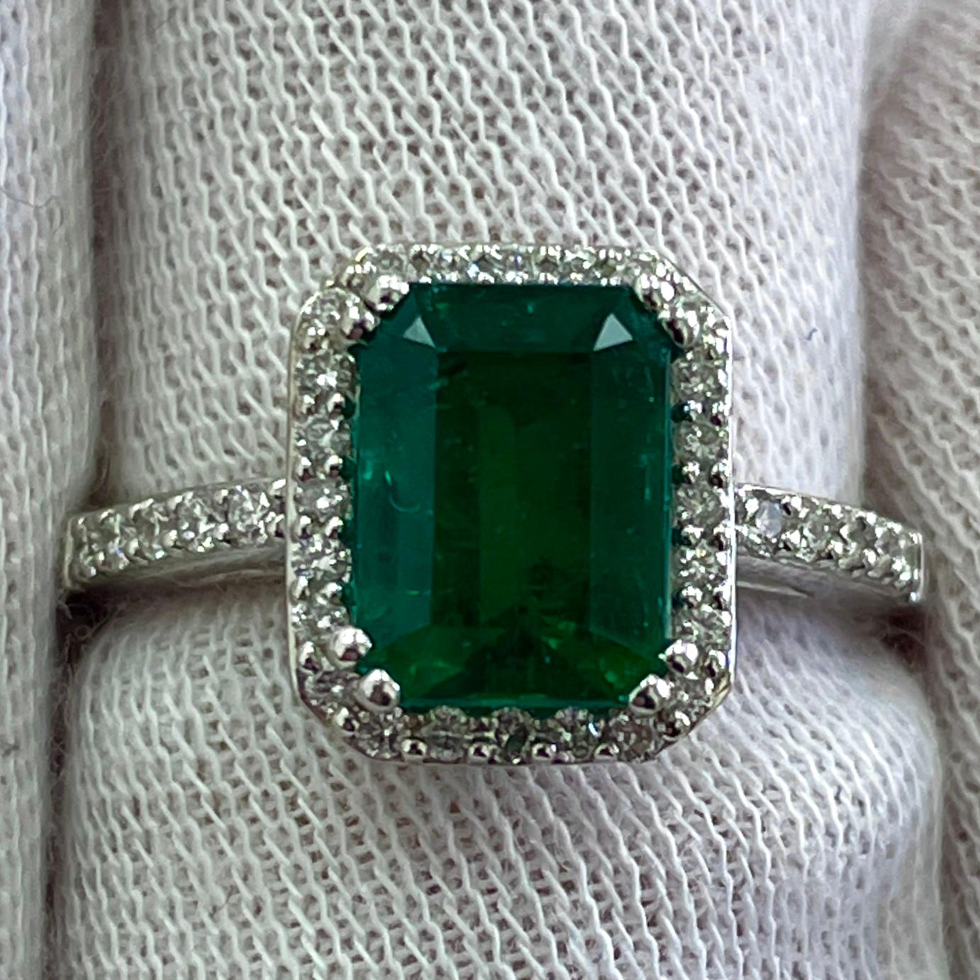 This is a rich green emerald, mounted in an elegant 18K white gold and diamond ring with 0.27Ct of brilliant white diamonds. Suitable for any occasion!