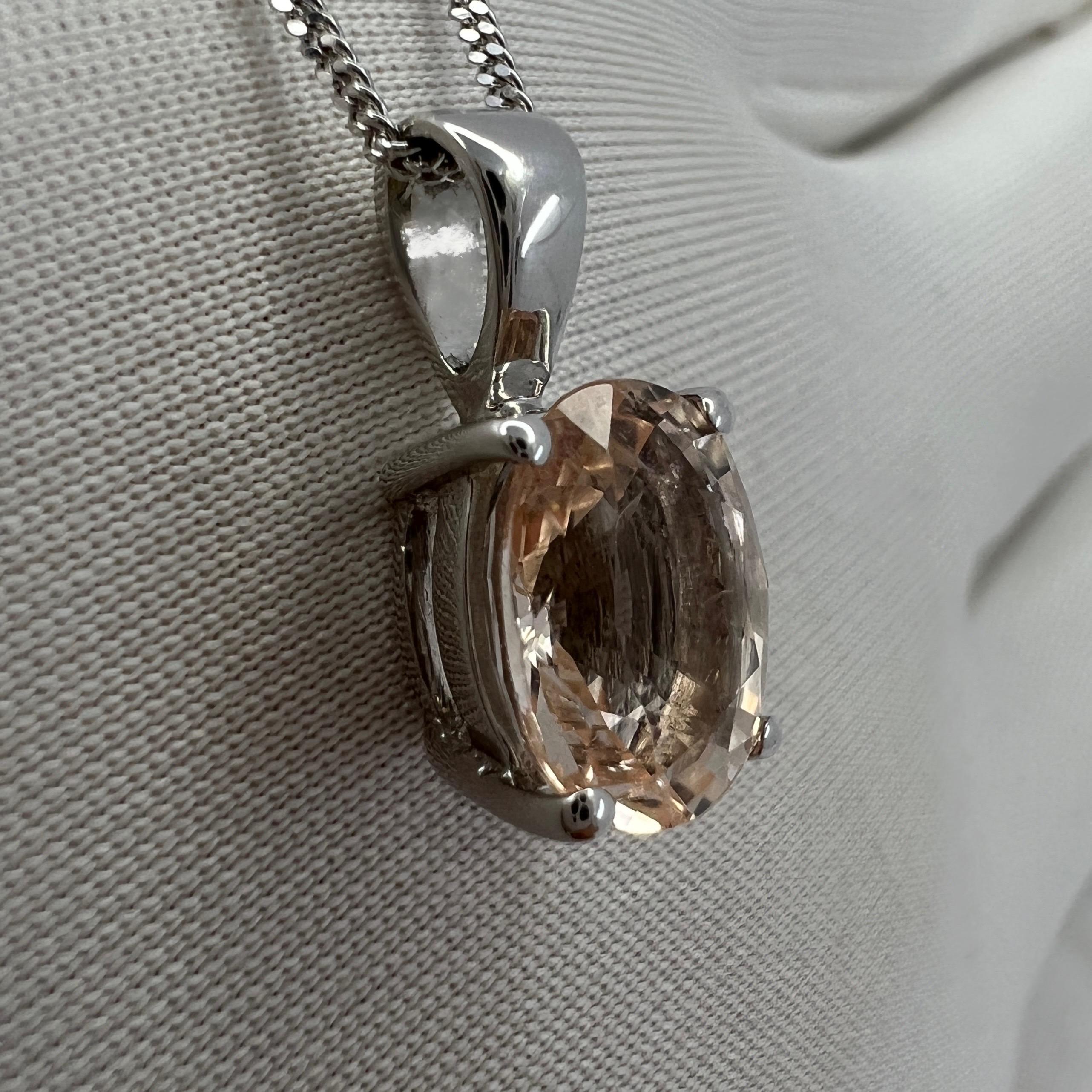 Oval Cut Morganite White Gold Solitaire Pendant Necklace.

Beautiful 1.81 carat peach pink morganite set in a fine 9k white gold solitaire pendant.
Stunning morganite with a beautiful peach pink colour and excellent clarity, some small natural