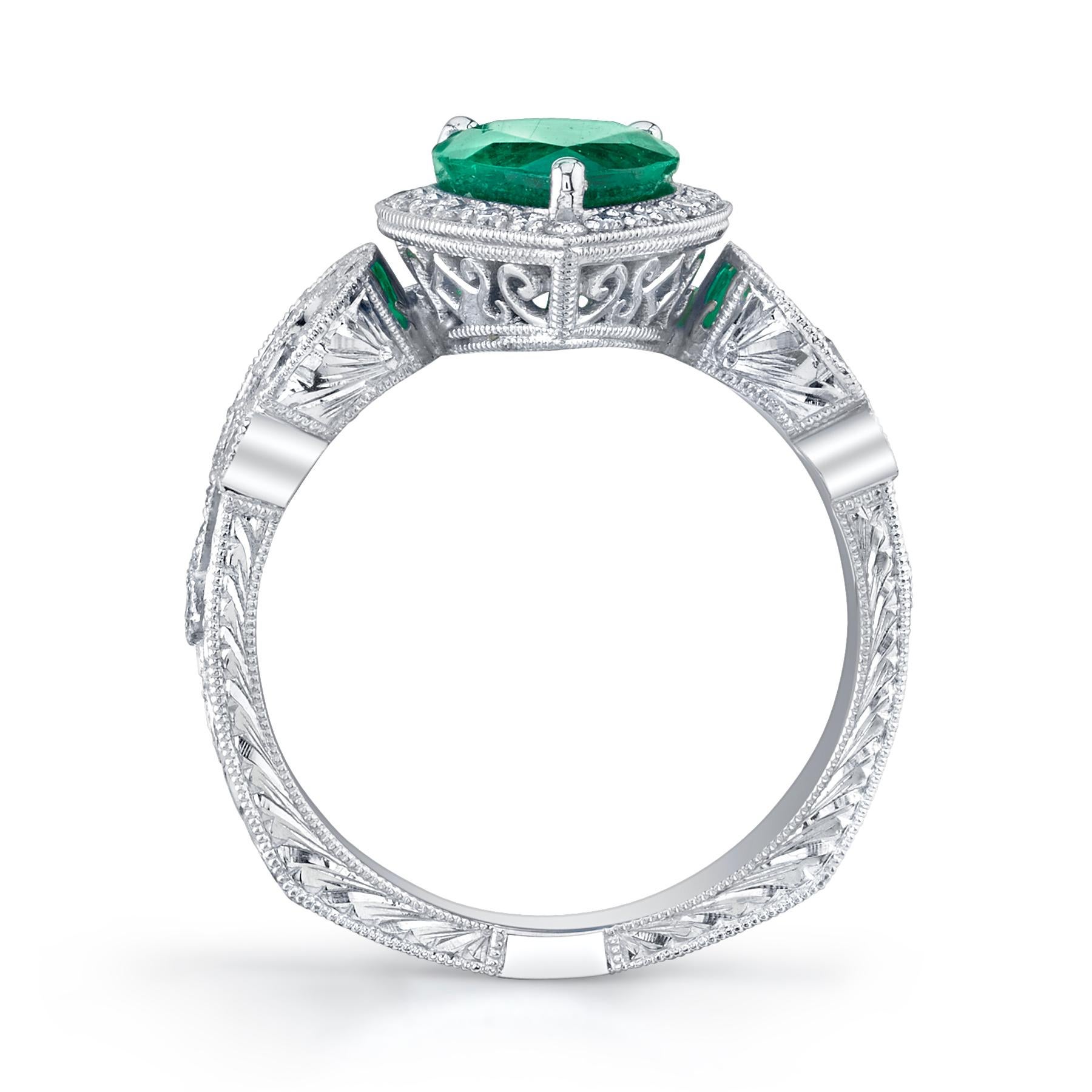 Pear Shape Columbian Emerald & Diamond Ring.

- Fine Milgrain
- Split Shank
- Platinum 
- Emerald (1) 1.81 carat total
- Round Brilliant Diamonds 0.42 carat total weight
- F/G in Color
- VS in Clarity