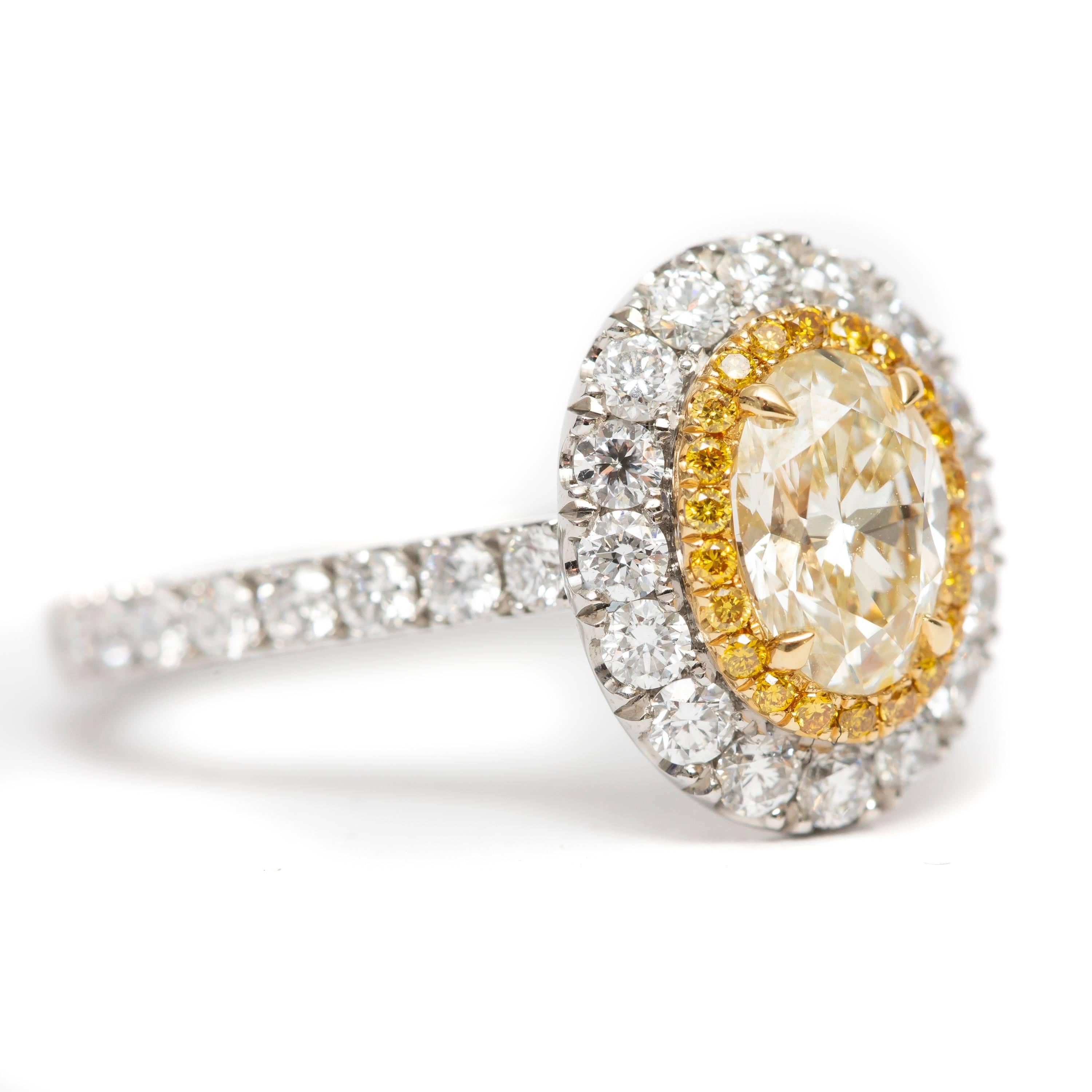 Platinum 1.81 Carat Yellow Oval Cut Diamond Double Halo Modern Engagement Ring In New Condition In London, GB