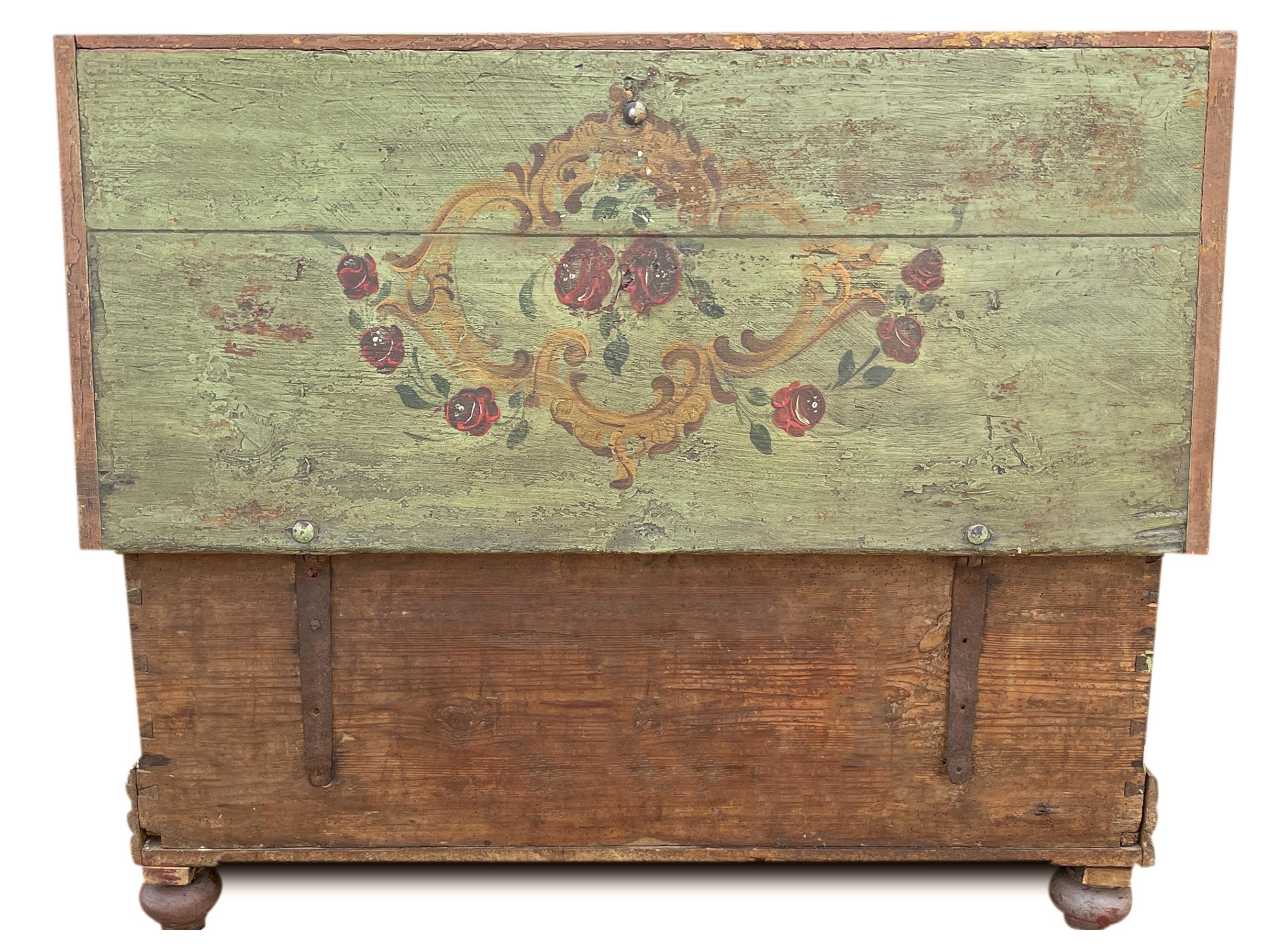 Alpine Green Floral Painted Blanket Chest

Period: about 1860
Origin: Tyrol
Essence: Fir

Measures:
Height: 49cm
Width: 113 cm
Depth: 51 cm

Description:
Tyrolean chest entirely painted in sage green. On the front, two flower baskets are enclosed in