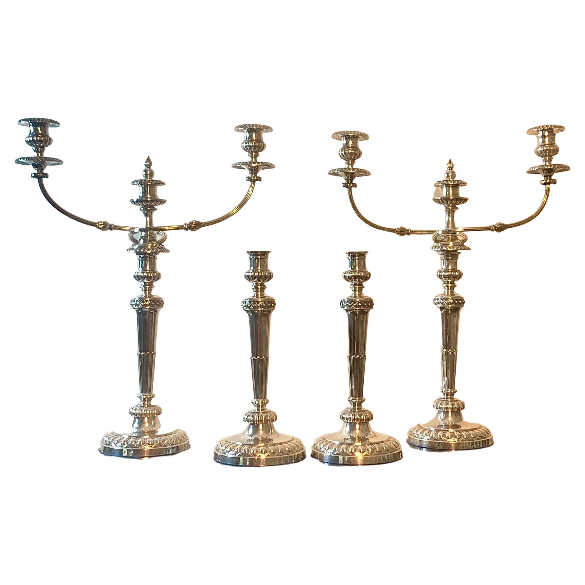 Hard to find suite consisting of 2 Matthew Boulton three-light candelabra & 2 matching candlesticks. This grouping was cared for and kept together for over 50 years by the previous owner in their Beverly Hills estate. 

Candelabra size: 22.5