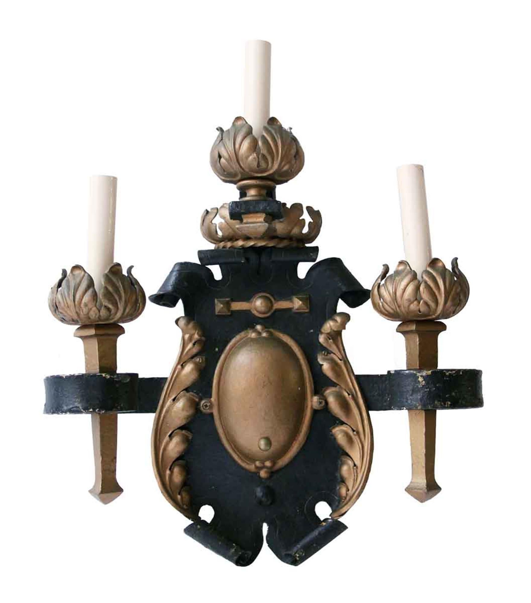 Pair of 1810 electrified French made triple candlestick arm wrought iron and gilt metal sconces. One sconce needs a simple repair in the middle which is included when we rewire these. Please note, this item is located in one of our NYC locations.