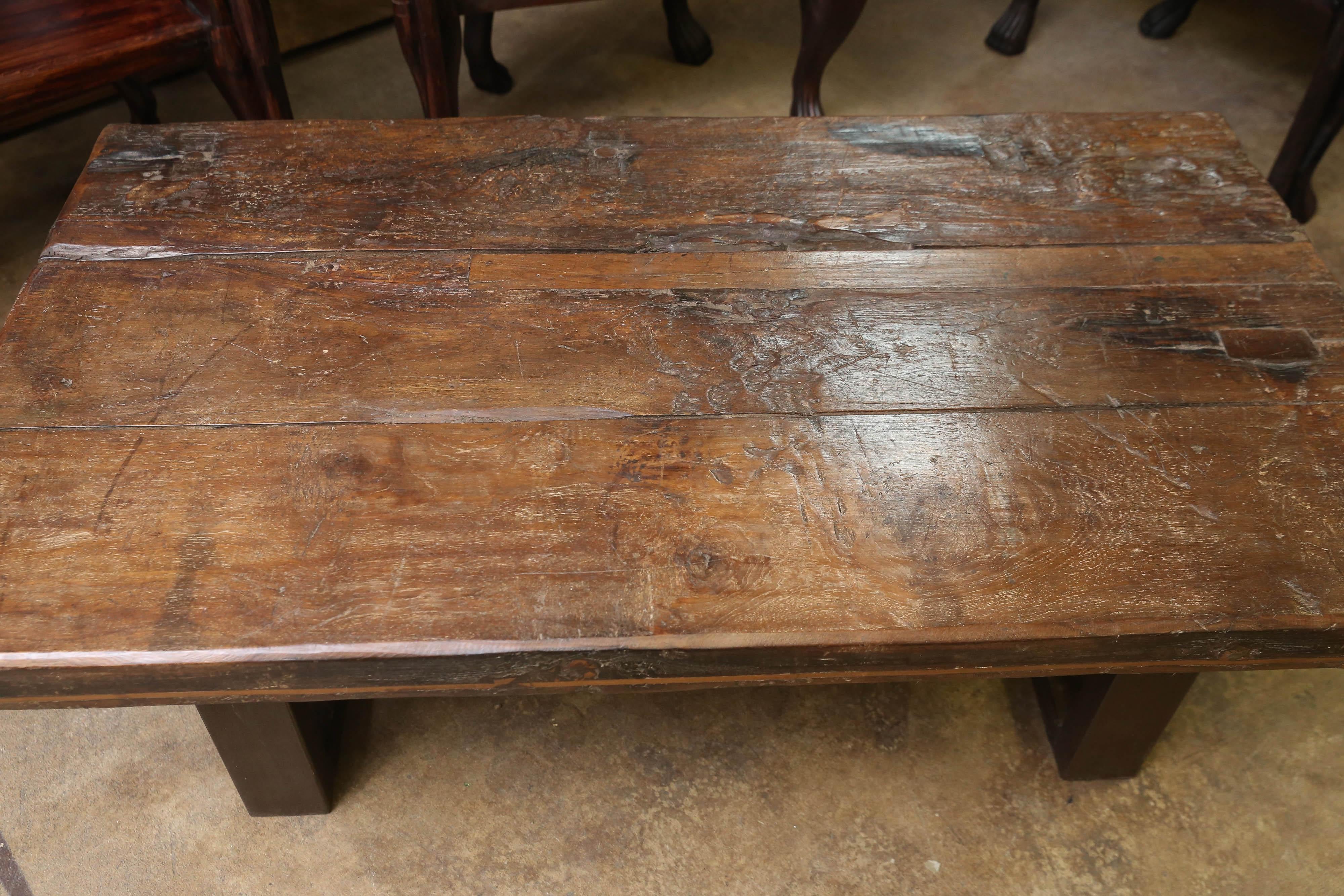Just by looking at the top of the table one can discern the age of the table. The scars and the patina of the very thick top tell the good and hard times the table had gone through. Made at a time when good wood was plentiful. It has its grand and