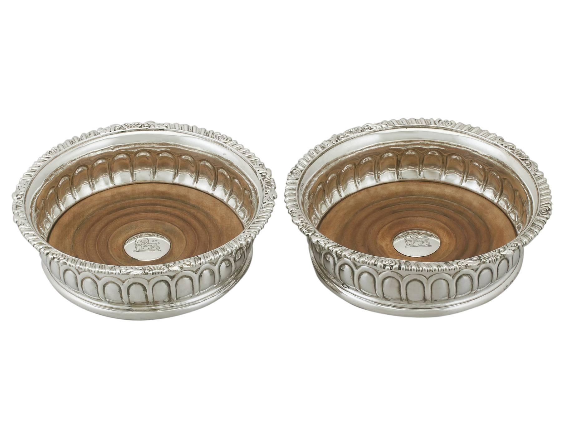 An exceptional, fine and impressive pair of antique George III English sterling silver coasters made by James Watson & Son; an addition to our range of collectable silverware.

These exceptional antique George III sterling silver wine coasters