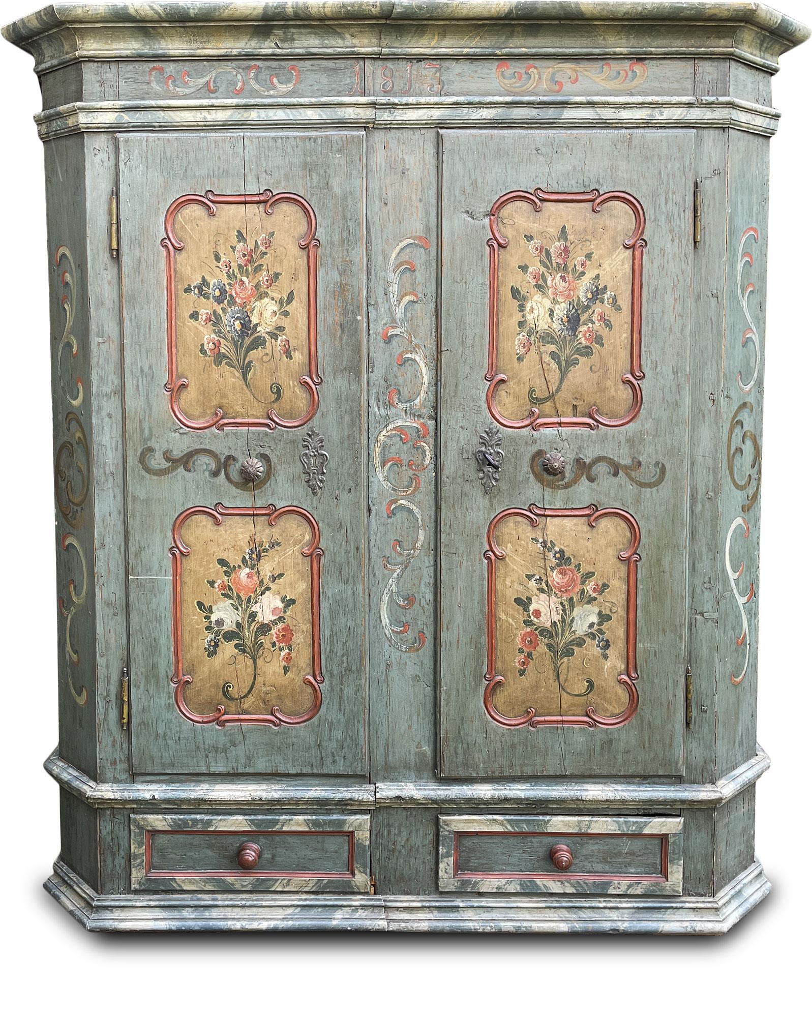 Tyrolean painted cabinet 1813.

Measures: H. 178cm - L. 145cm (158cm to the frames) - P. 47cm (55cm to the frames).

Tyrolean painted wardrobe with two doors and two drawers, entirely painted in blue / green. Ramages and faux marble motifs are