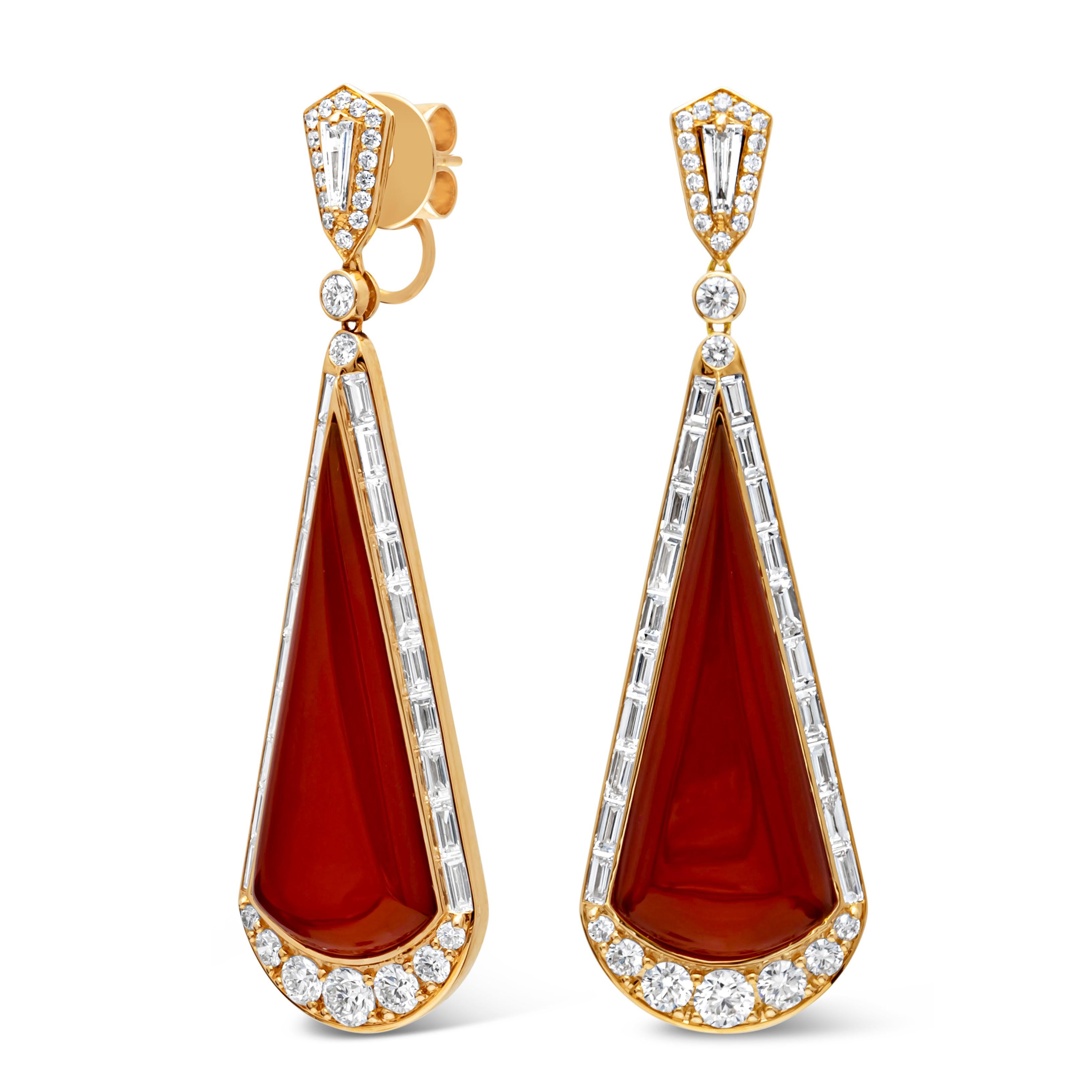 Showcasing a beautiful and fashionable dangle earrings set with color-rich brilliant trapezoid cut red agate stone weighing 18.15 carats total, surrounded by brilliant round and baguette cut diamonds in a timeless channel setting. Suspended on a
