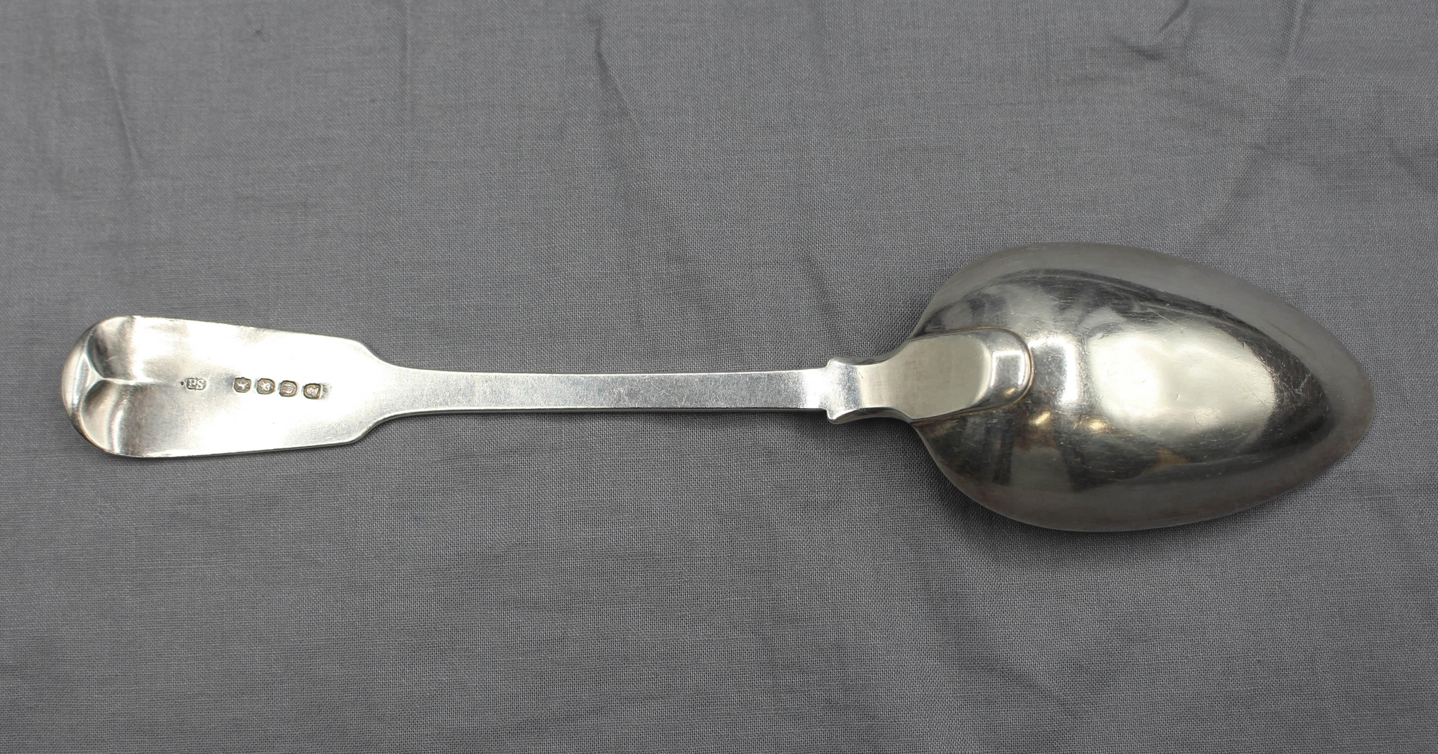 1815 sterling silver serving spoon by Paul Storr, English. Crested, Grimwade, p.162, mark 2235; fine condition. Minor bowl dents. 2.45 troy oz.
8.75