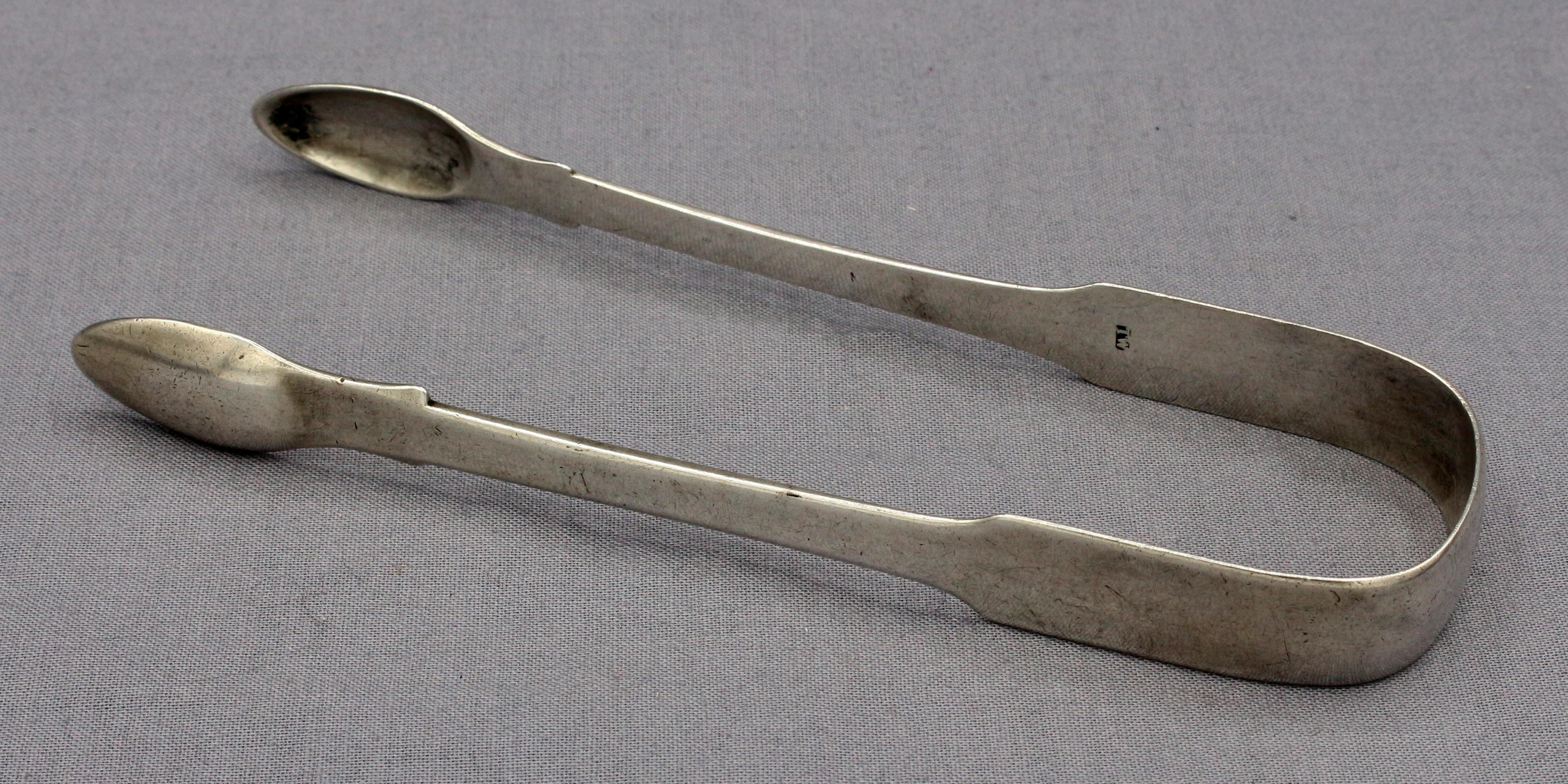 An 1815 pair of sugar tongs, sterling silver, Newcastle, by Thomas Watson one of the city's most prolific silversmiths. Crest of 13 families, Fairbairn pg.98, #14, a ducal coronet, martlet. 1.40 troy oz.
5 1/2