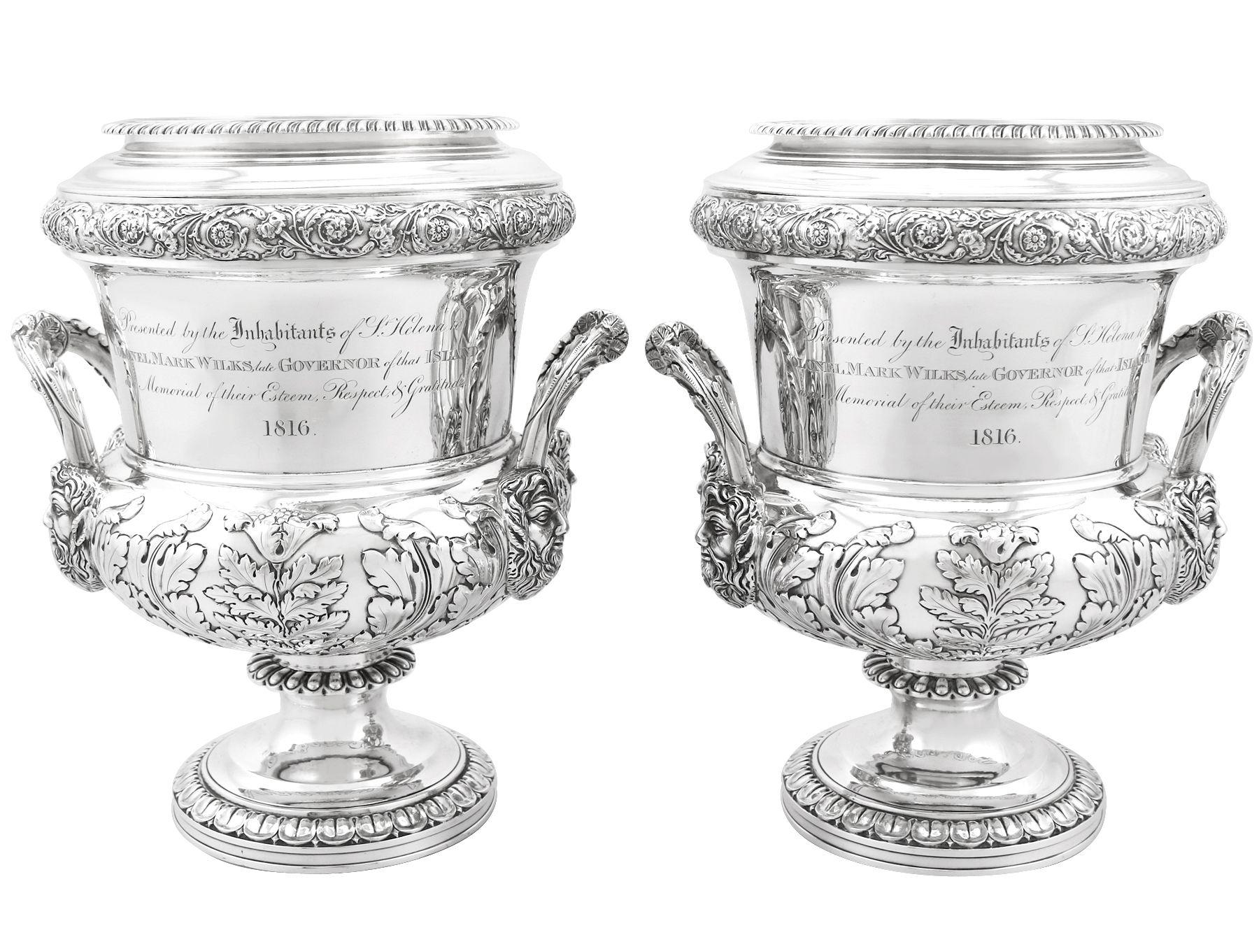 A magnificent, fine and impressive pair of antique Georgian English sterling silver wine coolers, an addition to our antique wine and drink related silverware collection.

These magnificent antique George III sterling silver wine coolers have a