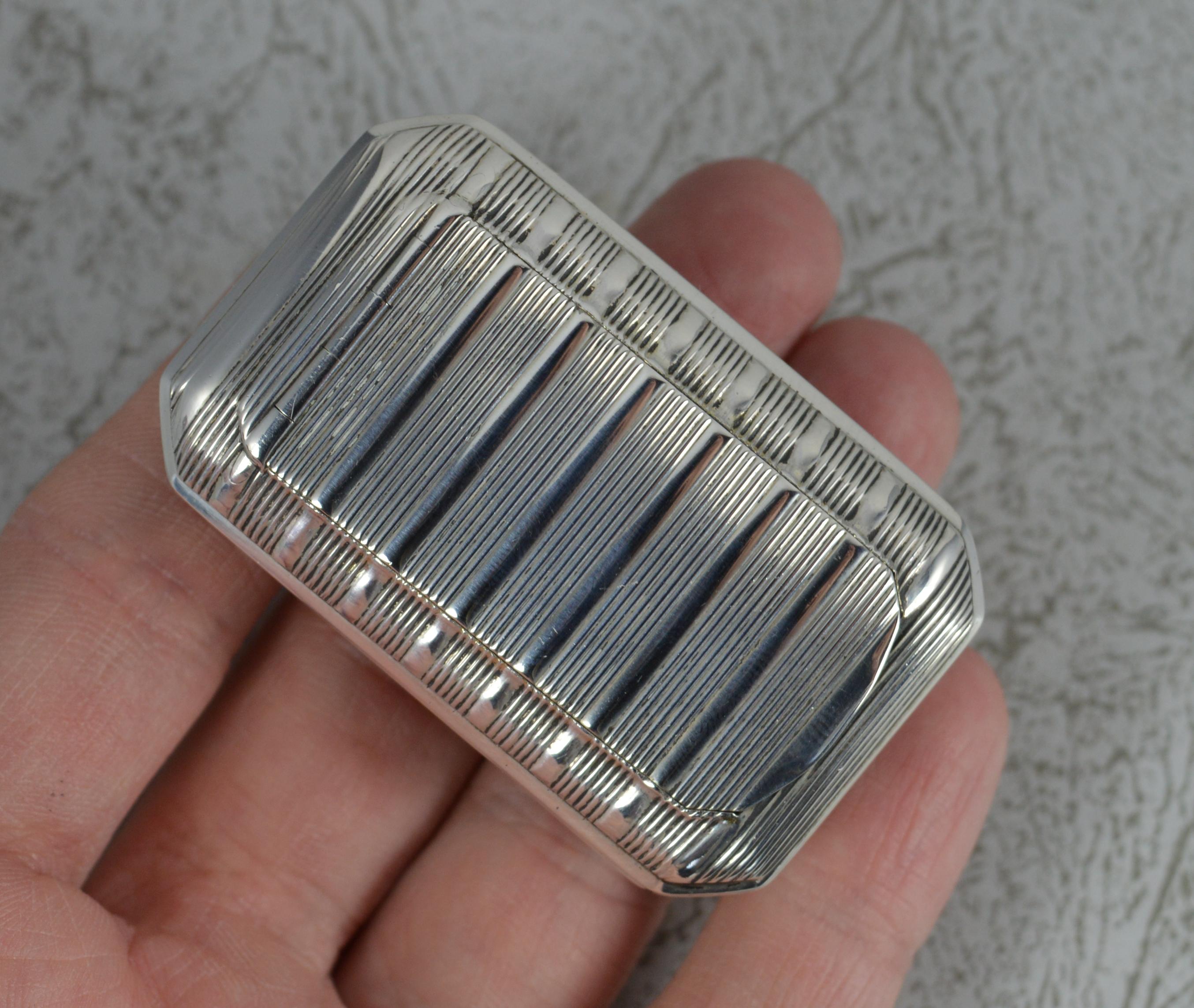 A beautiful solid silver snuff box.
George III period, English made.
Good gauge, shape and size.
Ridged finish throughout the rectangular shape. Bright gilt interior.

Hallmarks ; full hallmarks to edge of lid
Weight ; 29.2 grams
Size ; 3.5cm x