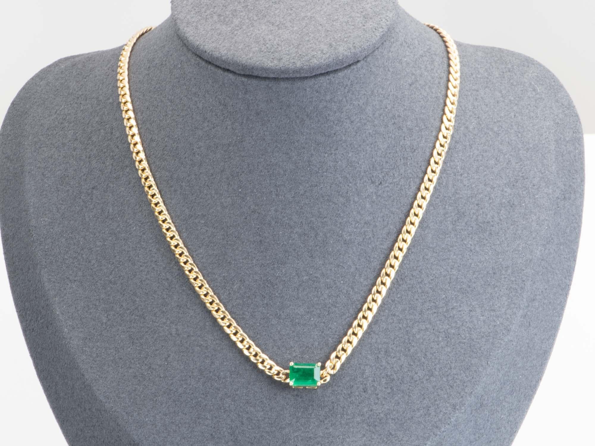   Sparkle in this timeless 1.81ct Zambian Emerald Sideways Set Necklace on a Miami Cuban Chain in 14K Gold. The minimalist and modern design showcases the rich green emerald, making this the perfect jewelry piece to add to your collection!

 ♥