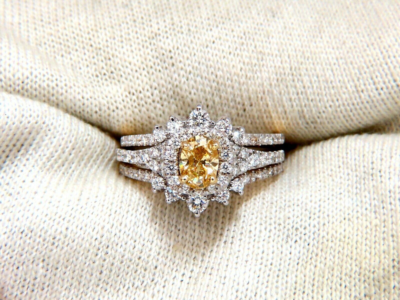 Contemporary Modern Fancy Yellow Cluster Ring

.51ct. Natural Yellow Diamond

Oval Cut

Si-1 clarity

6.2 X 4.3mm



Side diamonds: 1.30ct.

Rounds, Full cuts.

G-color Vs-2 clarity

  14kt. white gold

6.4 grams

Ring Current size: 7 

(Free Resize
