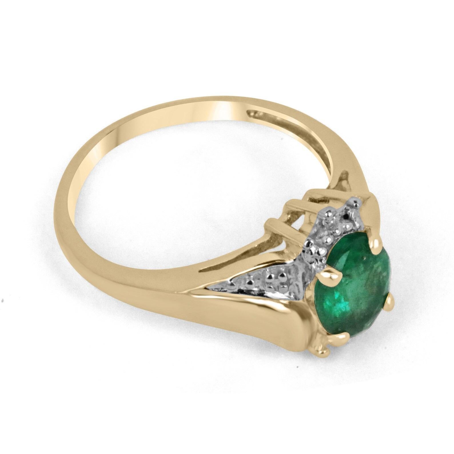 A stunning emerald and diamond accent ring. The center stone features a 1.74-carat, natural Zambian emerald, cut into the shape of an oval and displaying remarkable characteristics; such as desirable dark green color, good clarity with very good