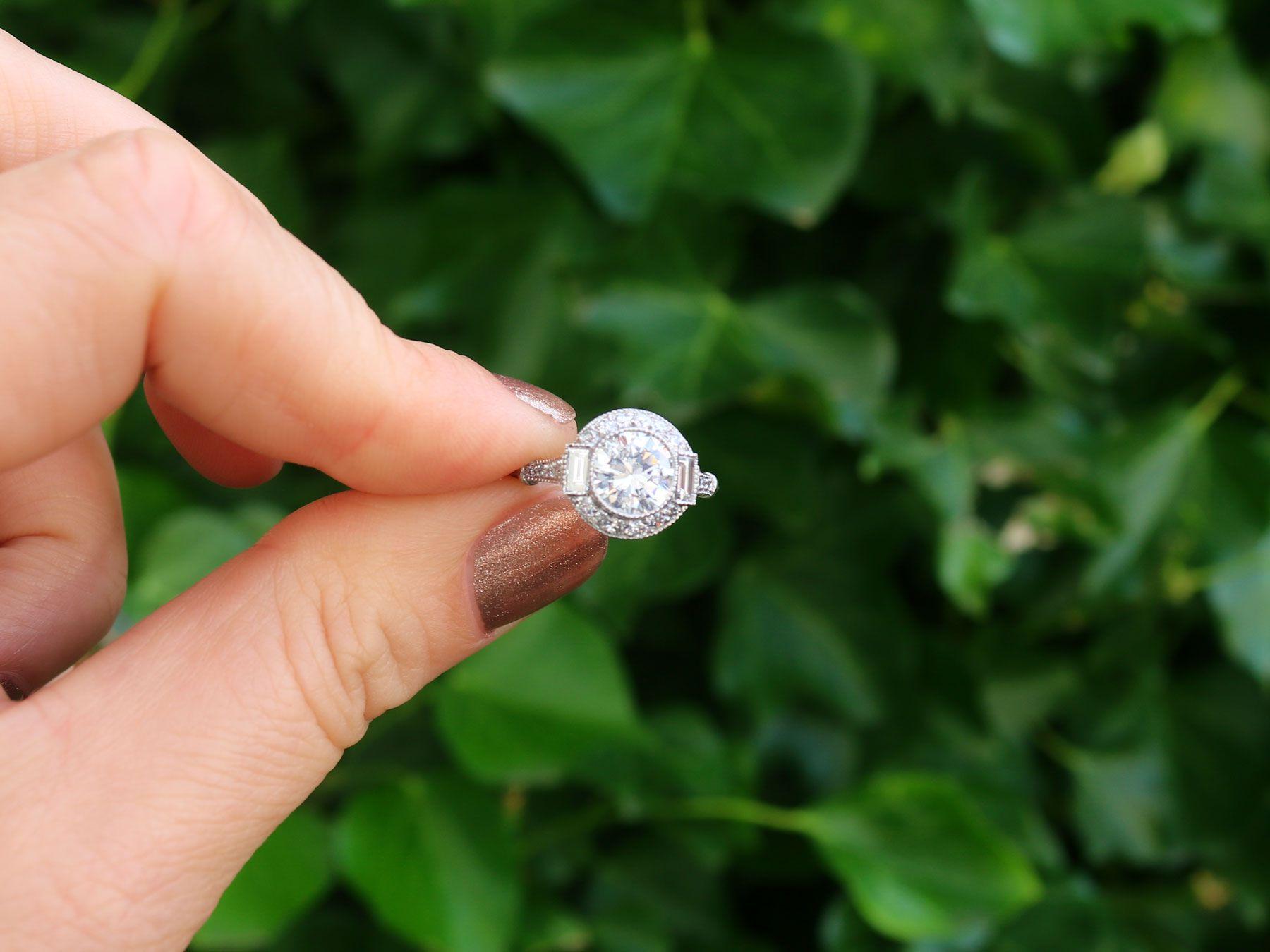 A stunning antique and contemporary 1.82Ct diamond and platinum halo style halo ring; part of our diverse diamond jewelry and estate jewelry collections.

This stunning, fine and impressive diamond halo ring has been crafted in platinum.

The