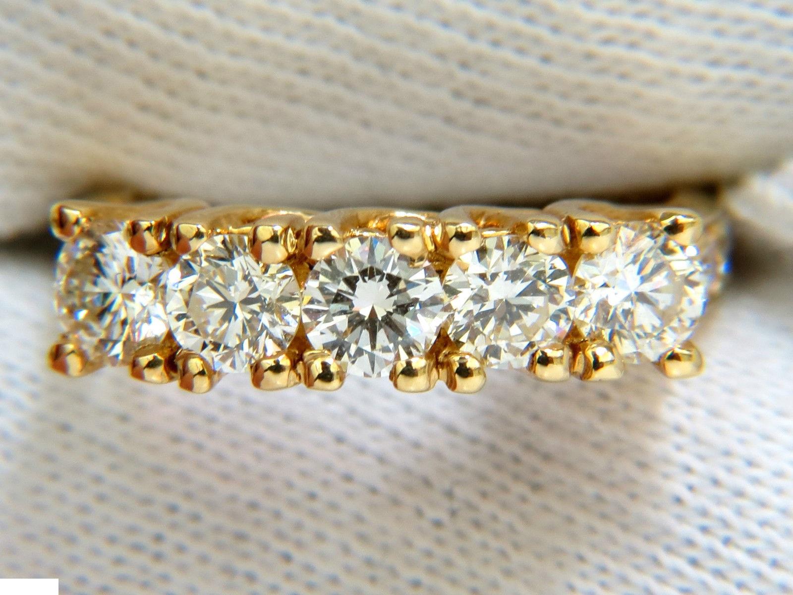 1.82ct. 5 diamonds Raised up band 

includes side pave mount diamonds

Rounds, Full Brilliant cuts

Vs-1 clarity

I-J color

14kt yellow gold.

Item: 6.0gms.

5.2mm thick

Current size: 6.25

Can be resized, please inquire

14kt. yellow gold.