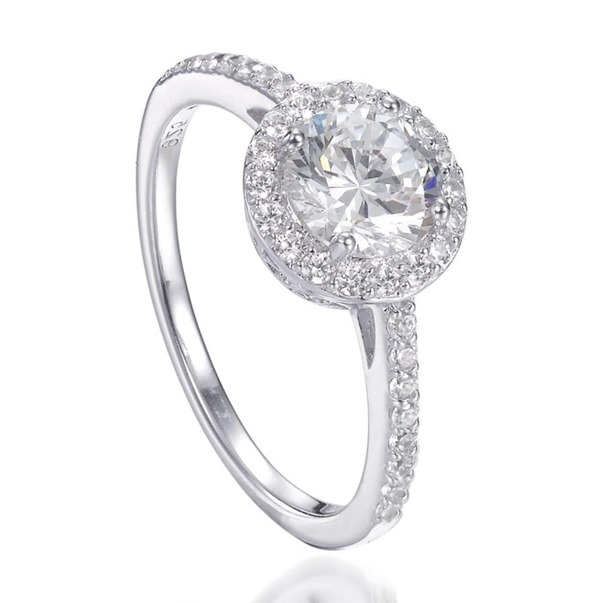 An alluring halo of diamonds embrace and accentuate the 1.82ct centre brilliant cut in this antique-style ring. Smaller brilliant cut accents on the shoulders add a truly dazzling effect.

Composed of 925 sterling silver with a high gloss white