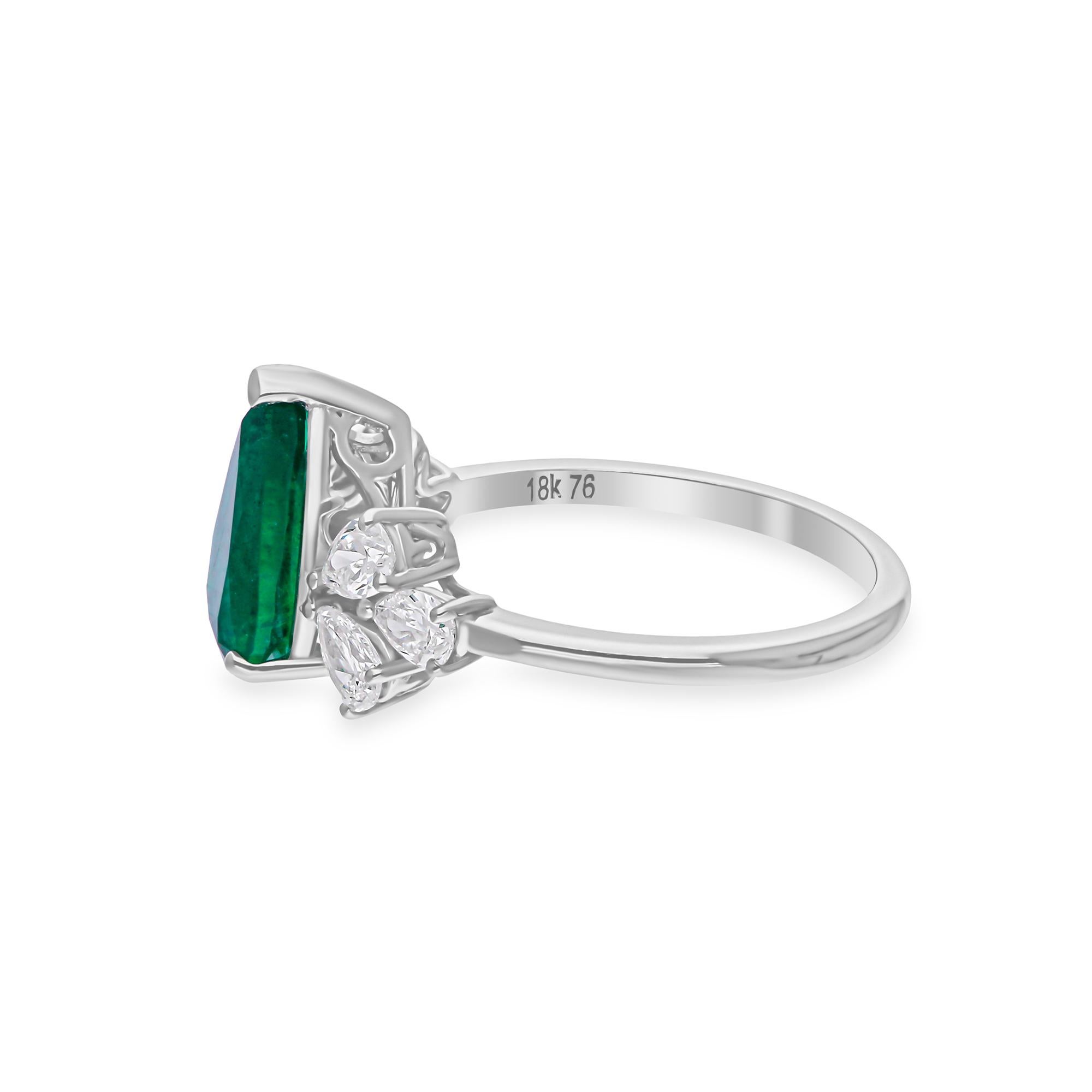 This ring has been meticulously crafted from 18-karat gold and handset with 1.82 carats Zambian Emerald and 0.72 carats of sparkling diamonds.

The ring is a size 7 and may be resized to larger or smaller upon request. FOLLOW SPECTRUM JEWELS