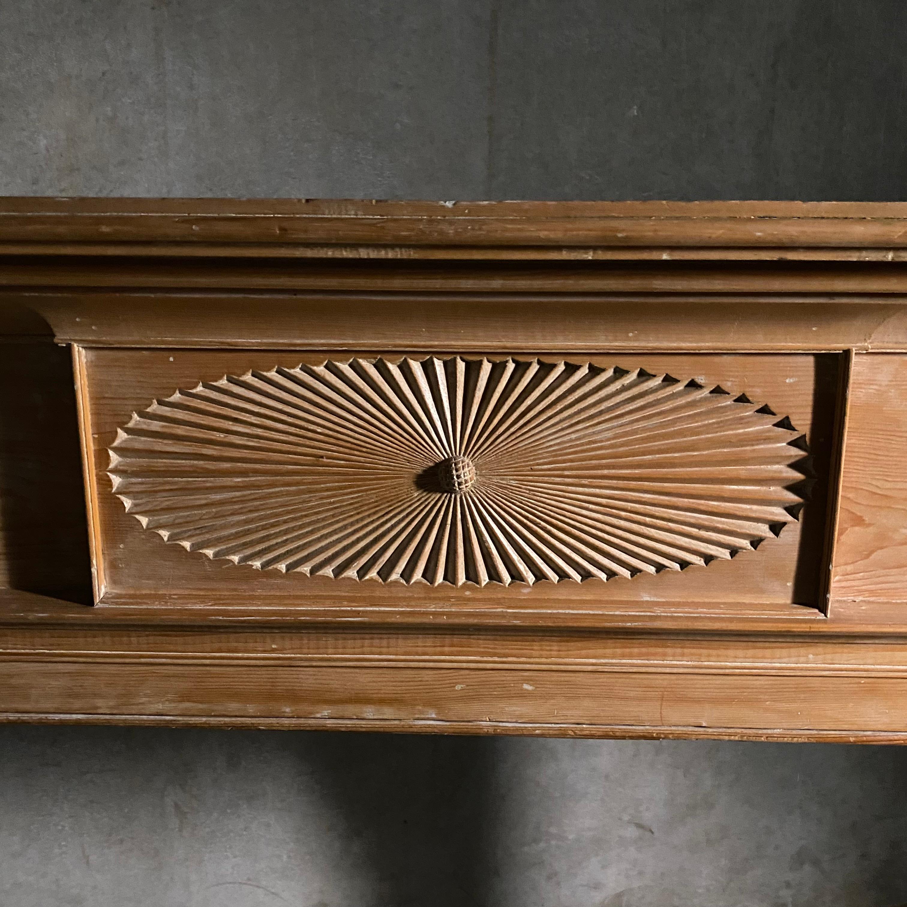 This 19th century mantel was found in Connecticut River Valley in the 1960's, New Hampshire. It features a rustic yet sophisticated formal presentation. The mantel details include channeling on the legs with a hand carved centre fan and acorn