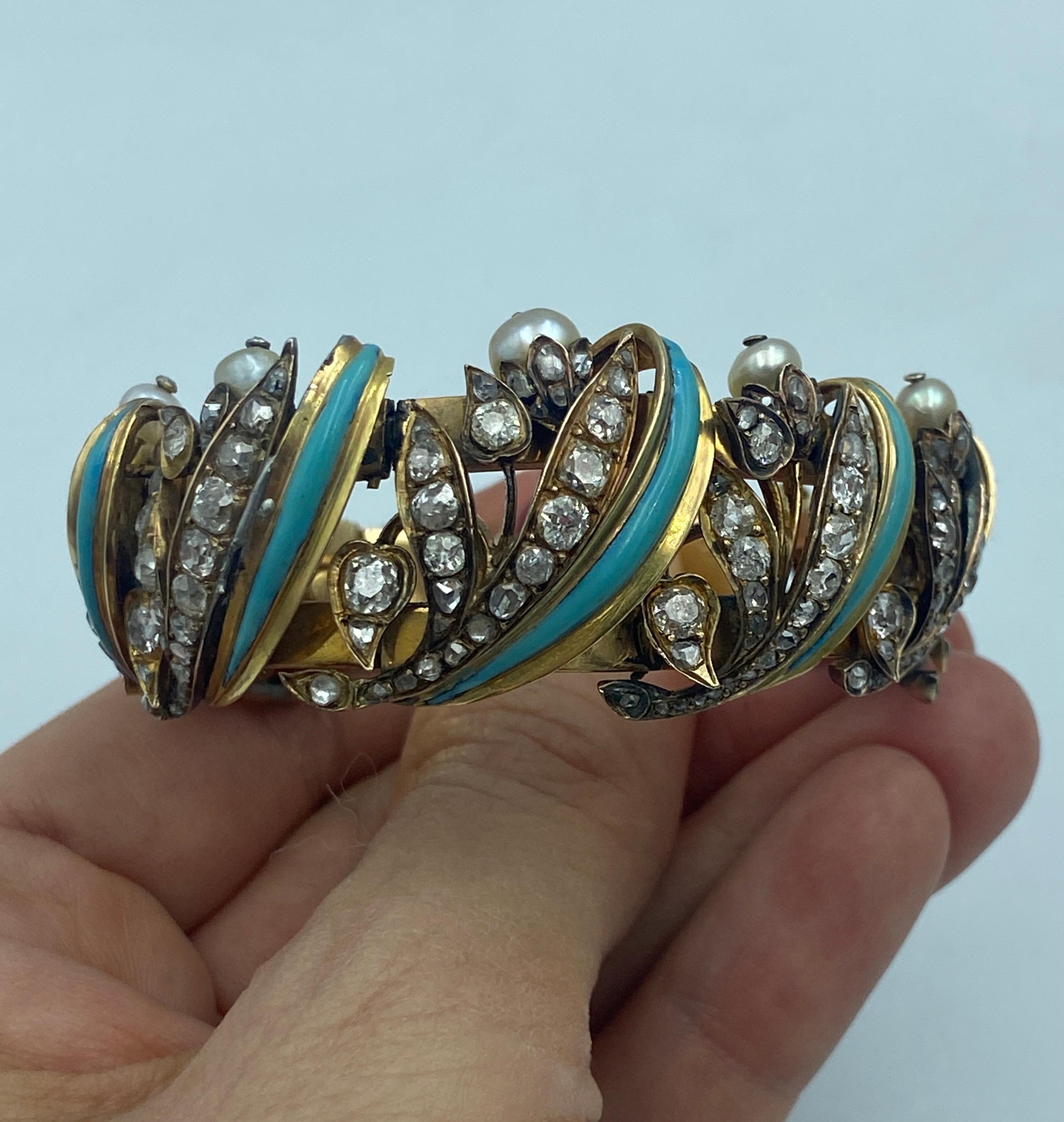 This unique European bracelet dating back to the 1820's is made of 18k gold, turquoise, natural pearls and approximately 4-5 carats of old mine cut diamonds. It is a remarkably beautiful piece and is a true collector's piece. The bracelet is