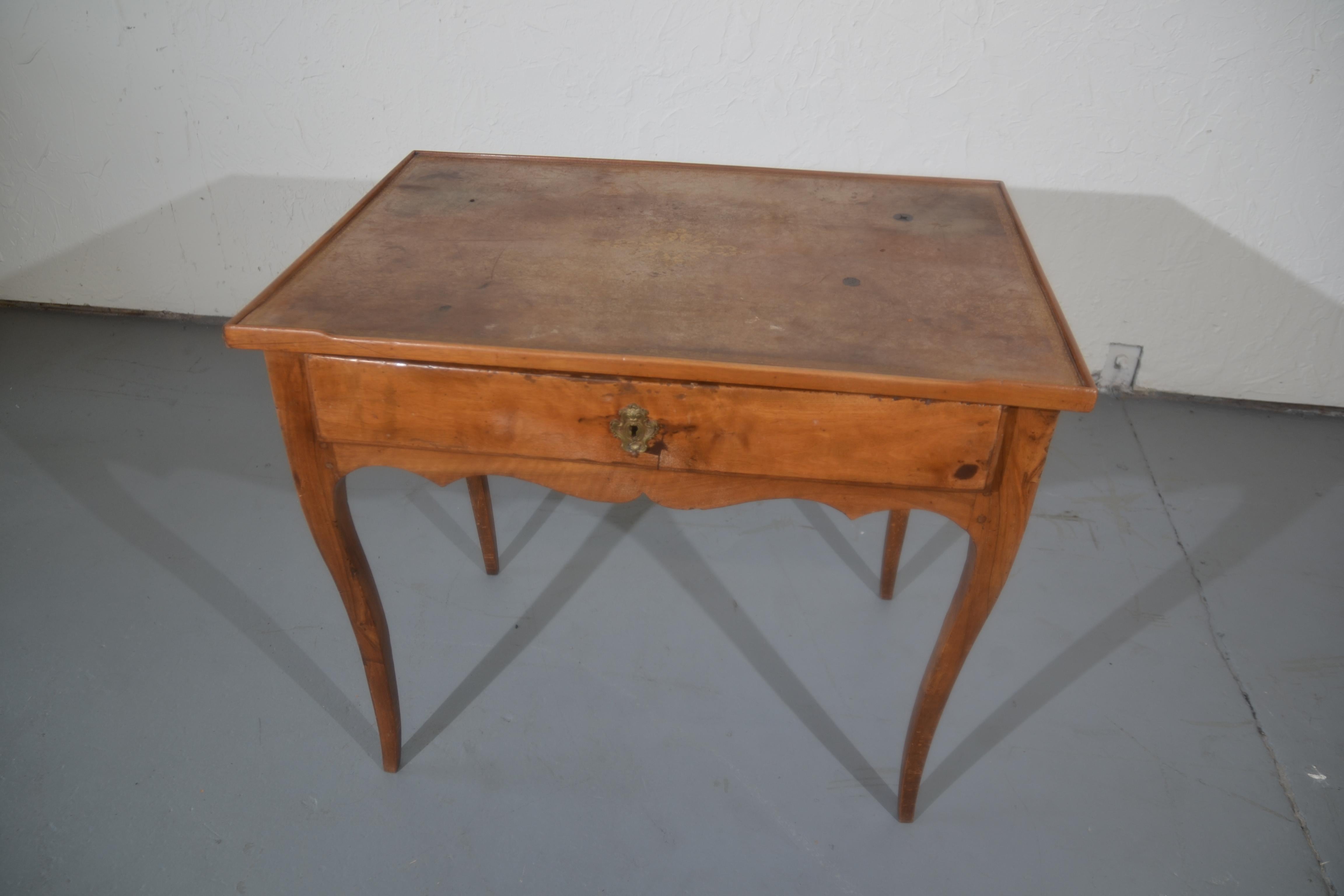 French 1820 Louis XV style leather top table with a single drawer.