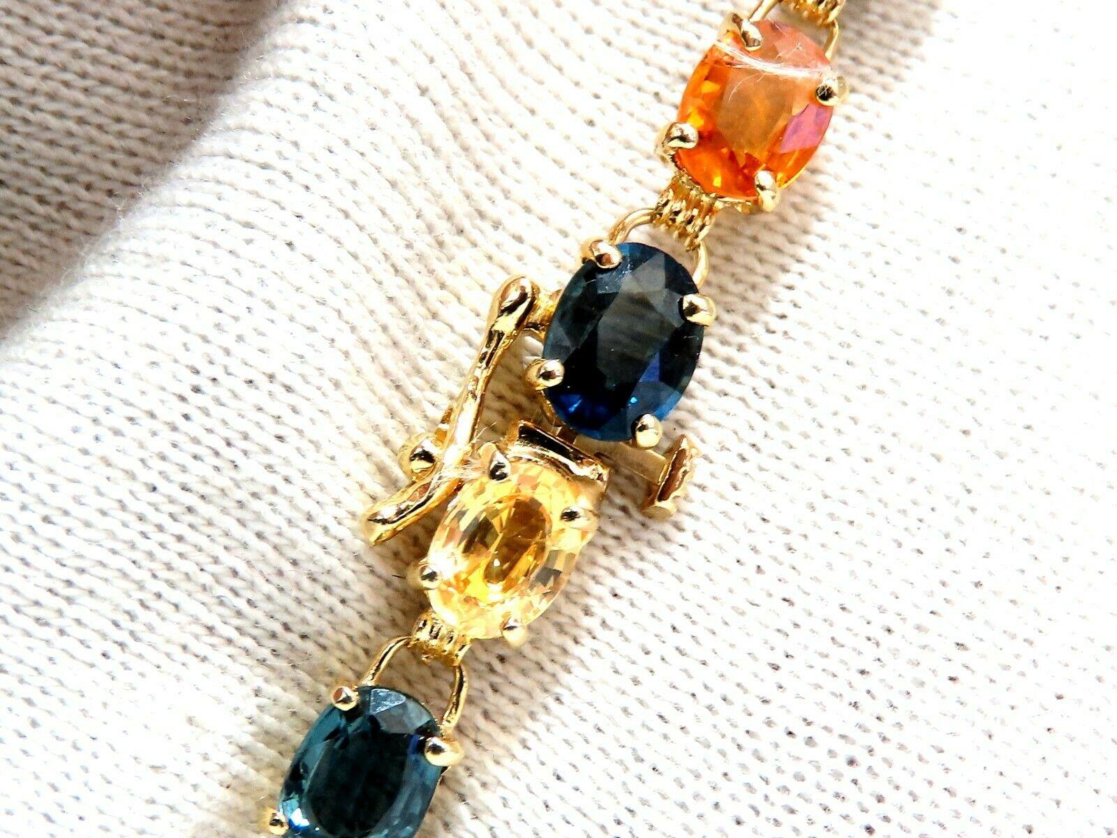 Natural Multi-color Sapphire Gem Line Vintage Bracelet

Assorted Fine Gem Colors Of 18.20ct. sapphires

Blues, Orange, Yellows and Light Greens

Average Each: 6.5 x 5mm 

14kt. yellow gold 10.2 Grams

Bracelet measures 7.5 inches.

Free Insured