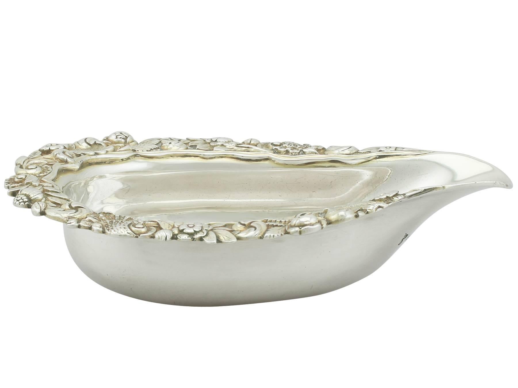 An exceptional, fine and impressive antique George IV English sterling silver pap boat; an addition to our silver dining collection

This fine antique George IV sterling silver pap boat or infant feeder has an oval plain boat shaped form.

The
