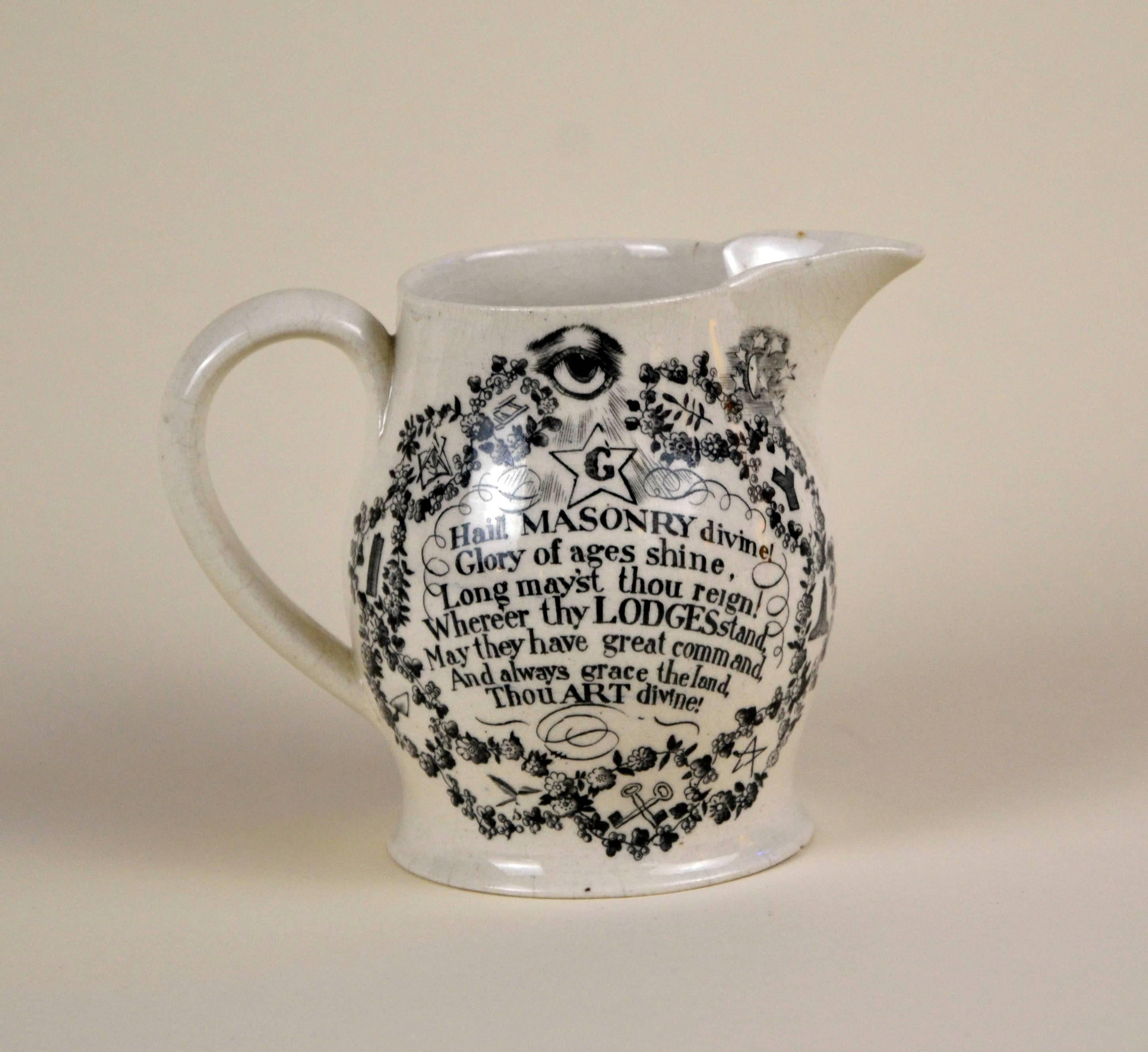 Early example of English Victorian Masonic ware. Cream ware jug with black transfer prints of Masonic symbols and a poem hailing Masonry.

Front: 
sit lux et lux fuit

Back:
Hail, Masonry divine!
Glory of ages, shine!
Long may’st thou reign: