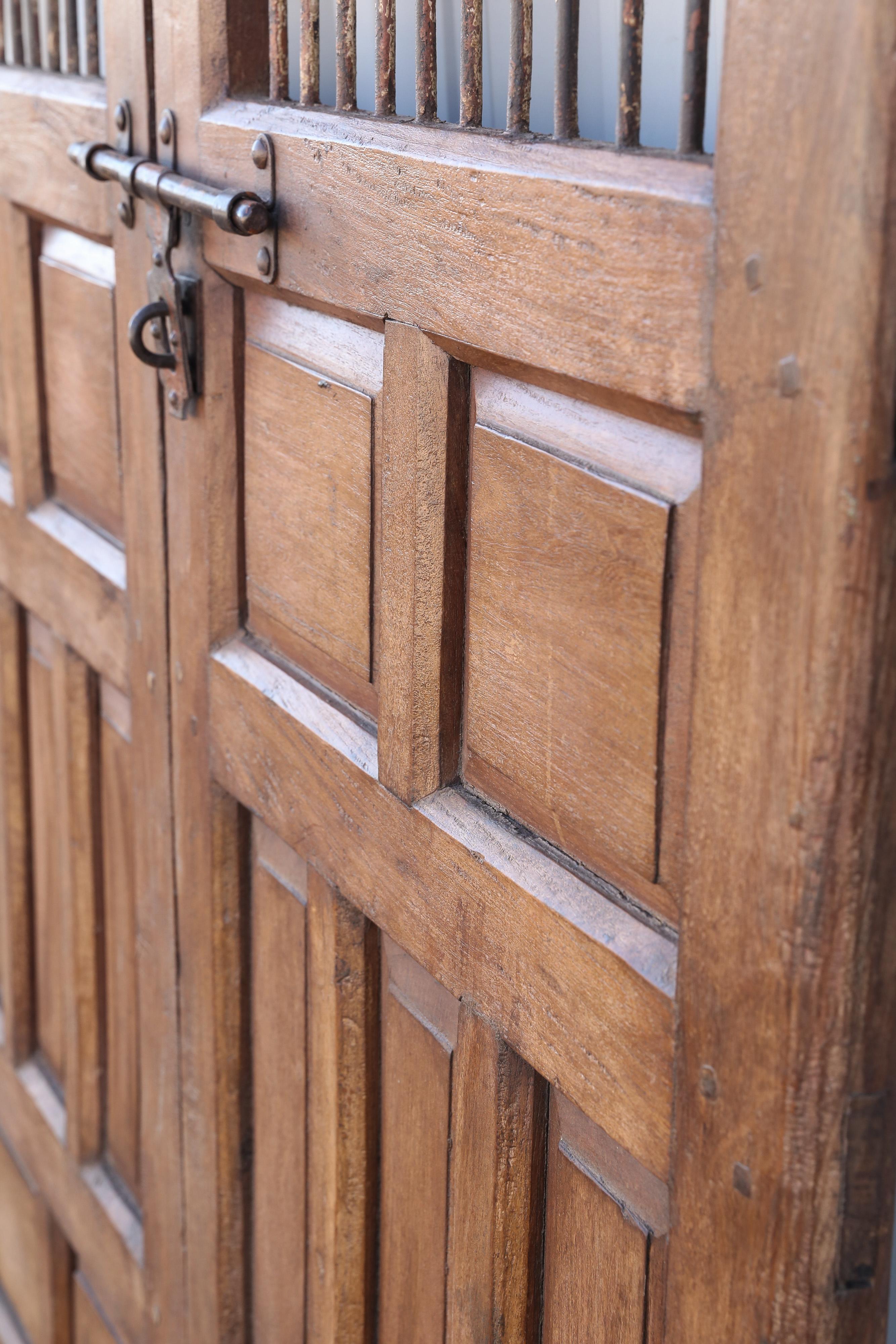 Anglo Raj 1820s Solid Teak Wood Side Entry Door of a Feudal Landlord's Court Yard Home For Sale