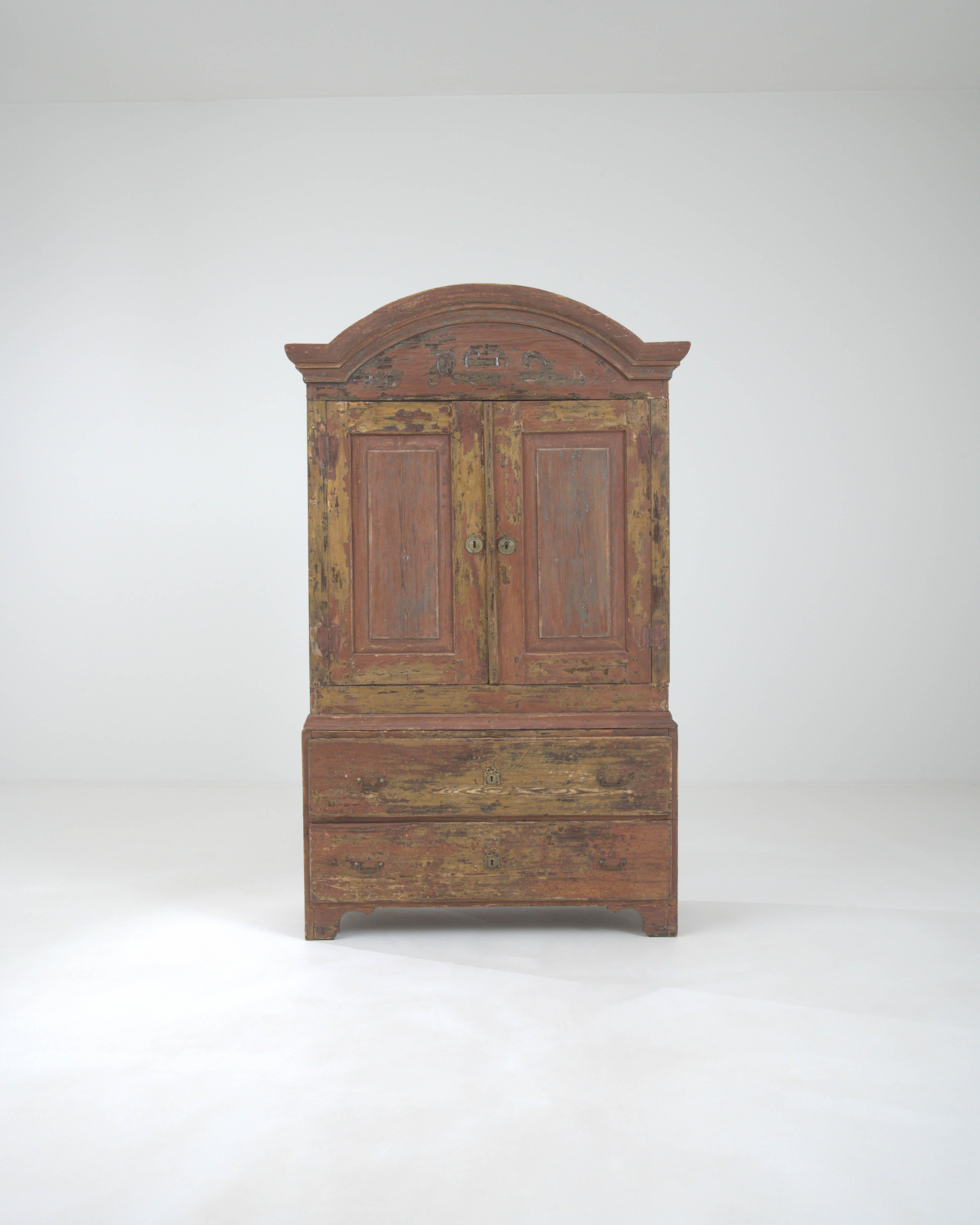 Step back in time with the 1820s Swedish Wood Patinated Cabinet, a magnificent piece that embodies the rich history and craftsmanship of the early 19th century. This cabinet's robust frame and time-worn patina tell a story of enduring strength and
