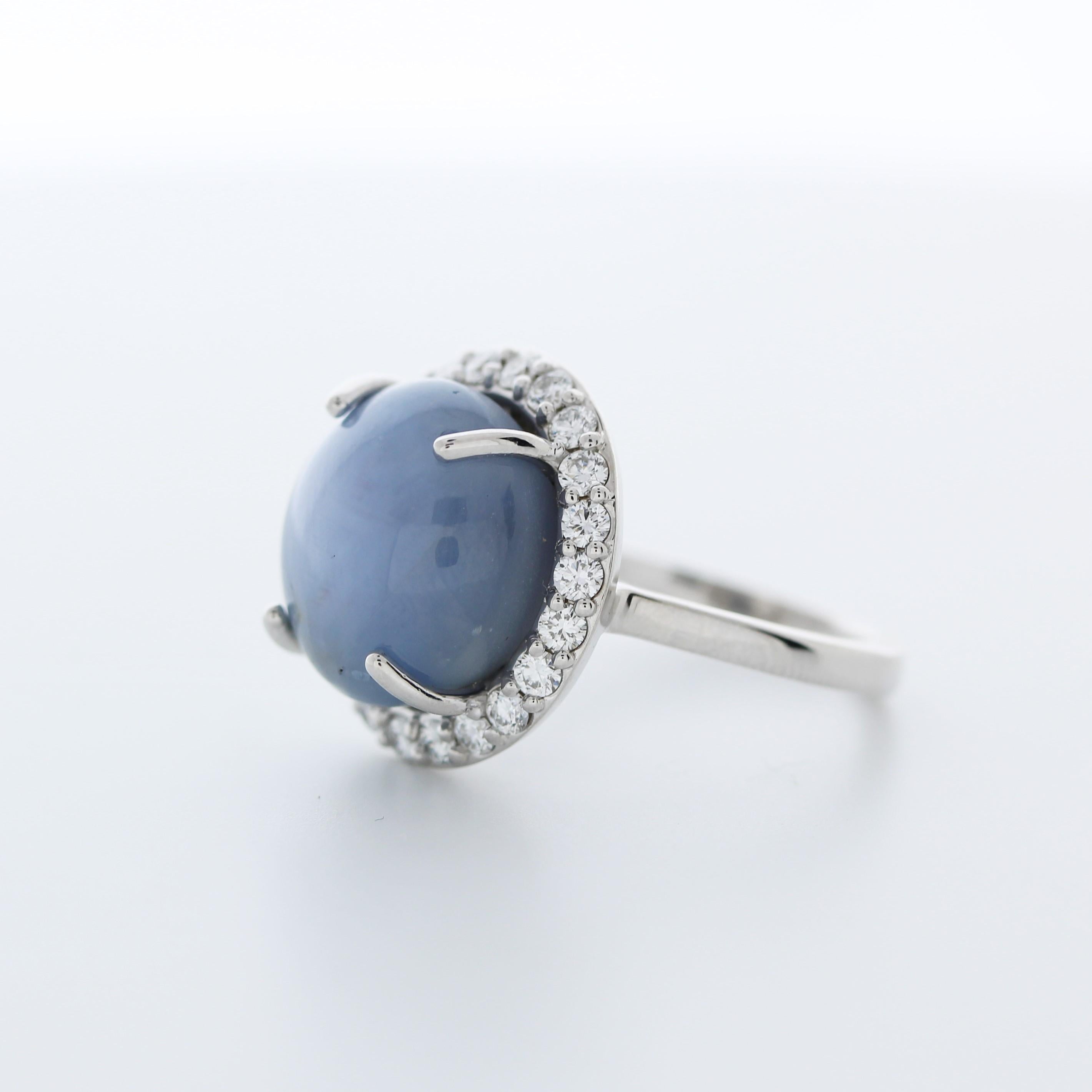A fashion ring featuring an 18k white gold band with a main stone of an 18.21 carat cabochon-cut star sapphire and 22 round-cut diamonds totaling 0.73 carats as side stones would be a stunning and eye-catching choice.