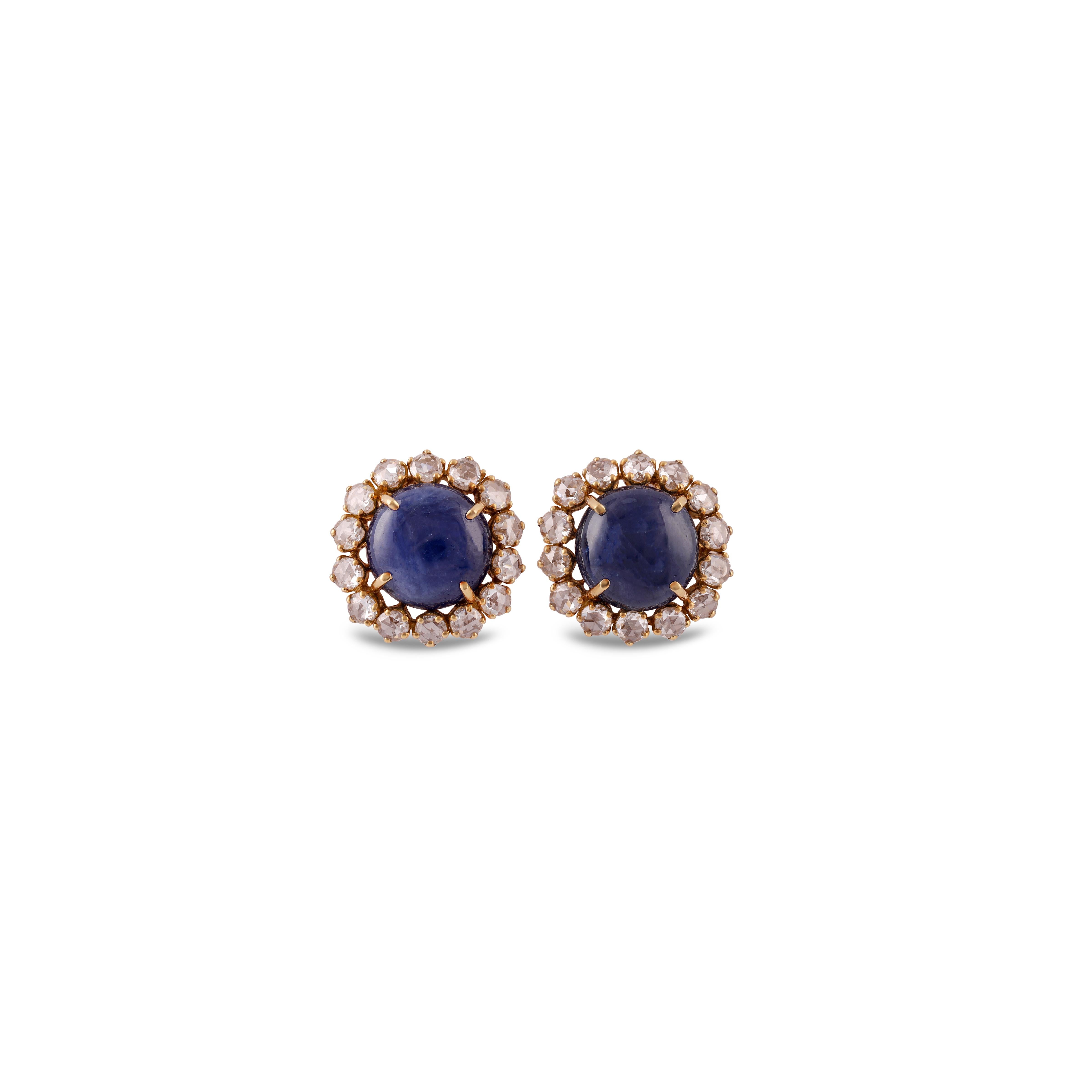 This is an elegant Natural Sapphire & diamond Earring studded in 18k gold with 2 piece of oval Cut  CAB Natural Sapphire weight 18.29 carat which is surrounded by 28 pieces of round shaped diamonds weight 2.56 carat, this entire Earring studded in