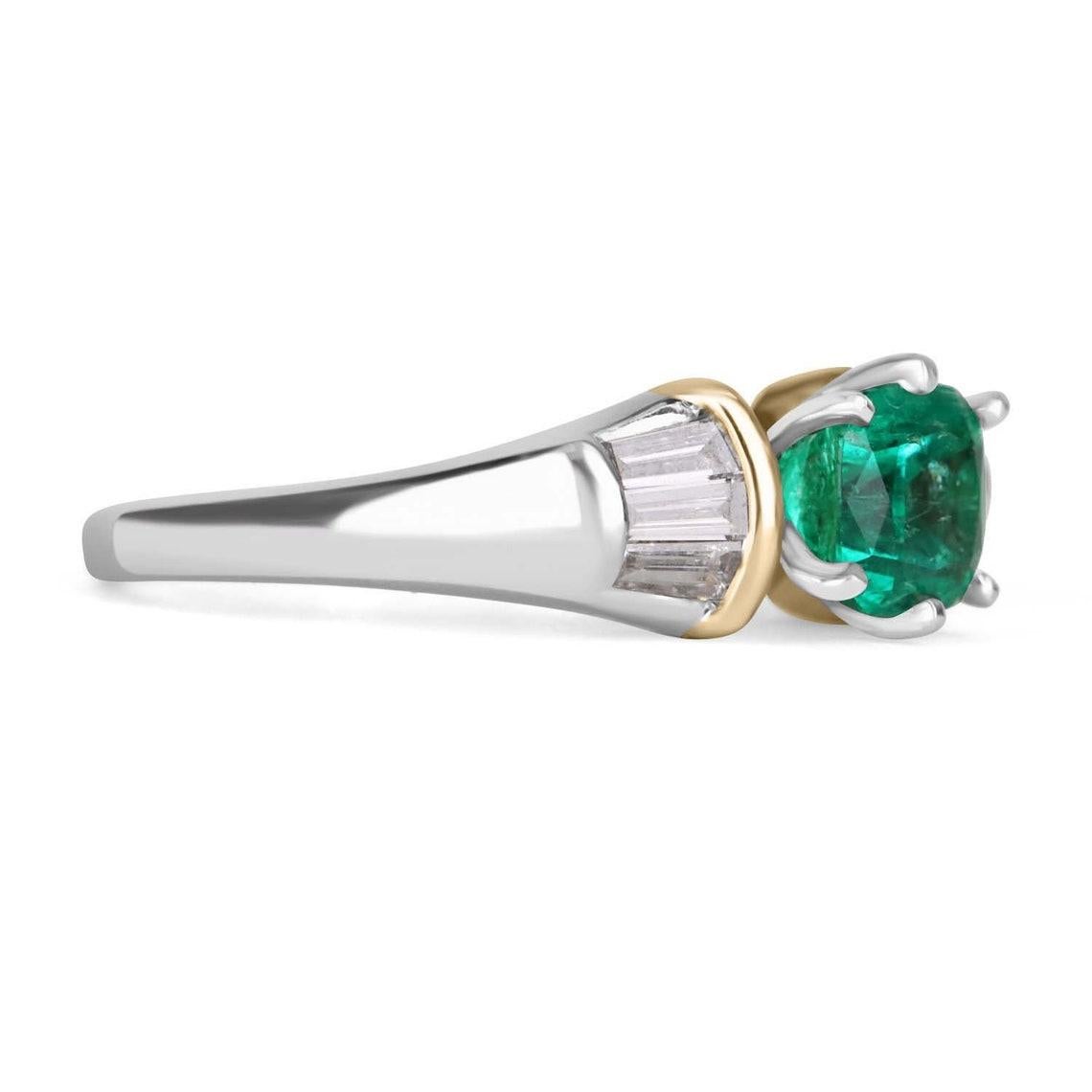 Displayed is a stunning AAA-quality Colombian emerald cushion and tapered baguette diamond ring. The center gemstone is a TOP quality Muzo mined emerald cushion handset in a six-prong secure setting that allows for a full view of the emerald. This