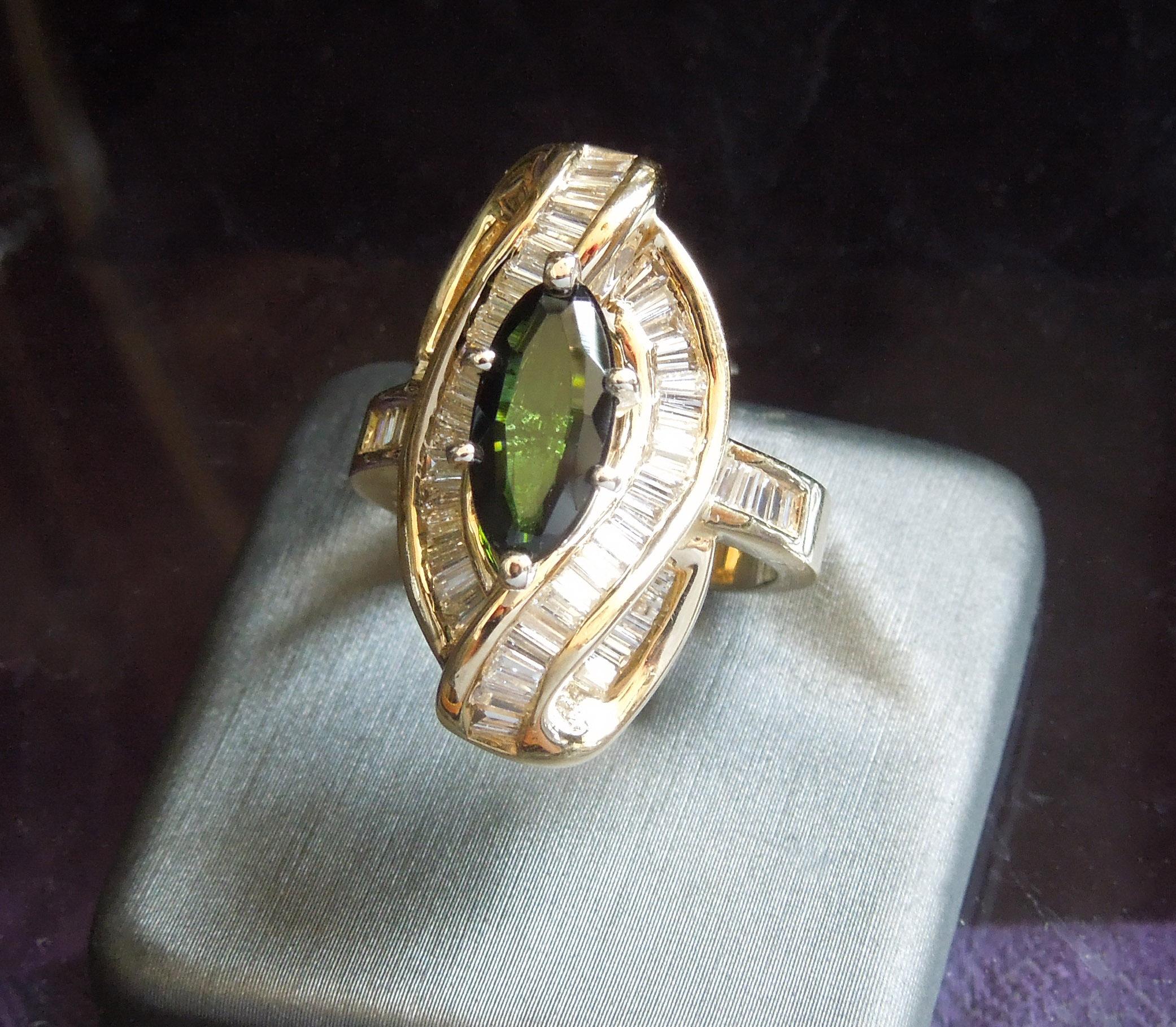 Containing 1 Central Elongated Oval cut Natural Green Tourmaline weighing approximately 1.83 carats at 11.3mm in length x 5.5mm at widest, secured in a 6-Prong Setting - A prized Precious Green Gemstone, becoming extremely rare with mines nearly