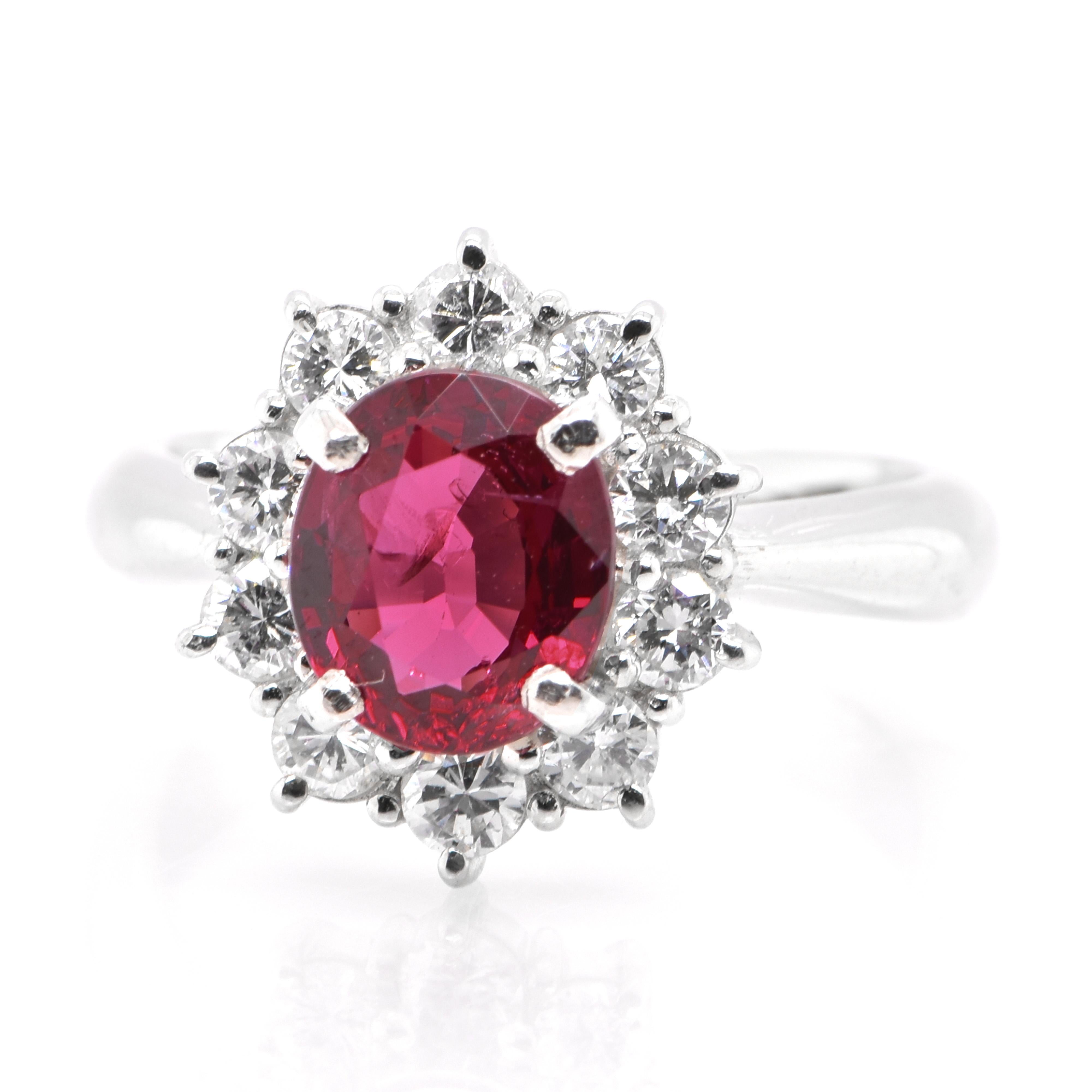 A beautiful halo ring featuring a 1.83 Carat Natural Red Spinel and 0.61 Carats of Diamond Accents set in Platinum. Spinel has been frequently confused with ruby, but it’s a gem that can stand on its own merits. Many historically important red gems,