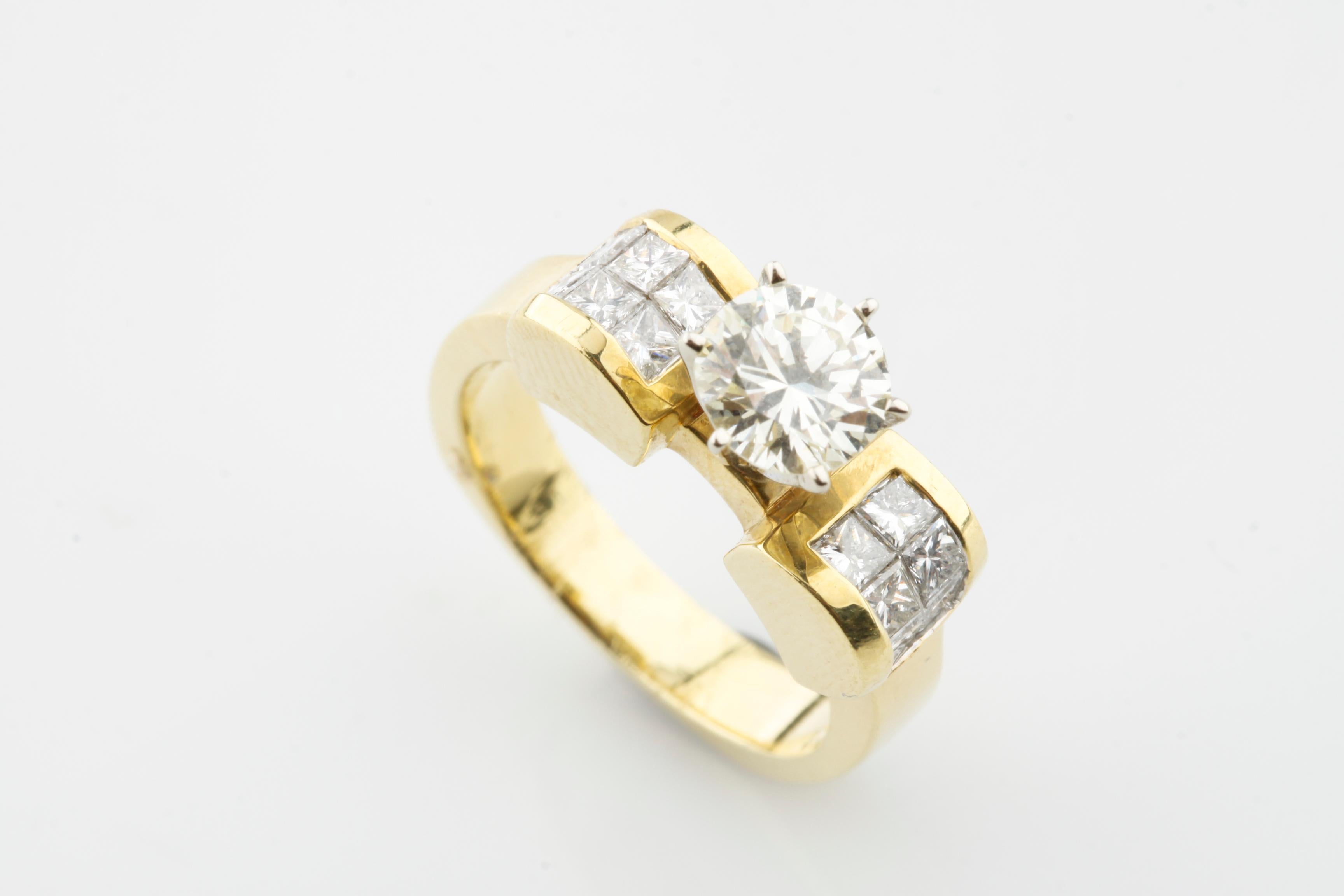 Gorgeous 14k Yellow Gold Solitaire Diamond Engagement Ring With Accents
Center Diamond Approximately 1.03 Cts / Color = J / Clarity = VS2
Channel Set Princess Cut Diamond Accents Approximately 0.80 Cts
Total weight: 9.47 grams 