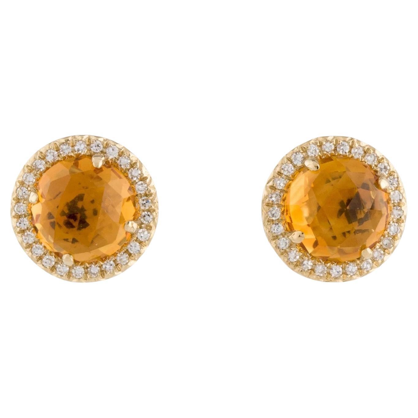 Ces boucles d'oreilles en citrine et diamant sont un accessoire étonnant et intemporel qui peut ajouter une touche de glamour et de sophistication à n'importe quelle tenue. 

Ces boucles d'oreilles présentent chacune une citrine ronde de 0,90 carat,