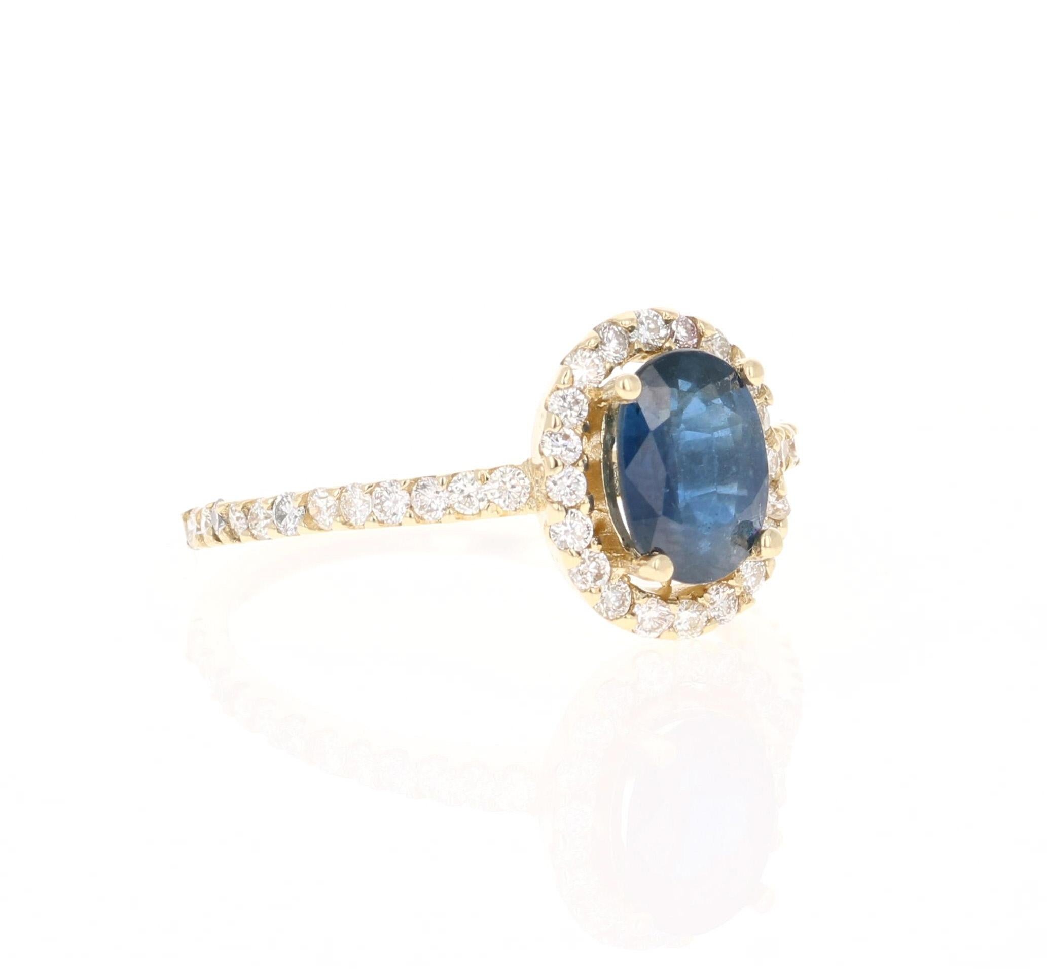 This ring has a Oval Cut Natural Blue Sapphire that weighs 1.26 carats and is surrounded by 44 Round Cut Diamonds that weigh 0.57 carats. The total carat weight of the ring is 1.83 carats. (Clarity: VS, Color: H)

The ring is set in 14 Karat Yellow