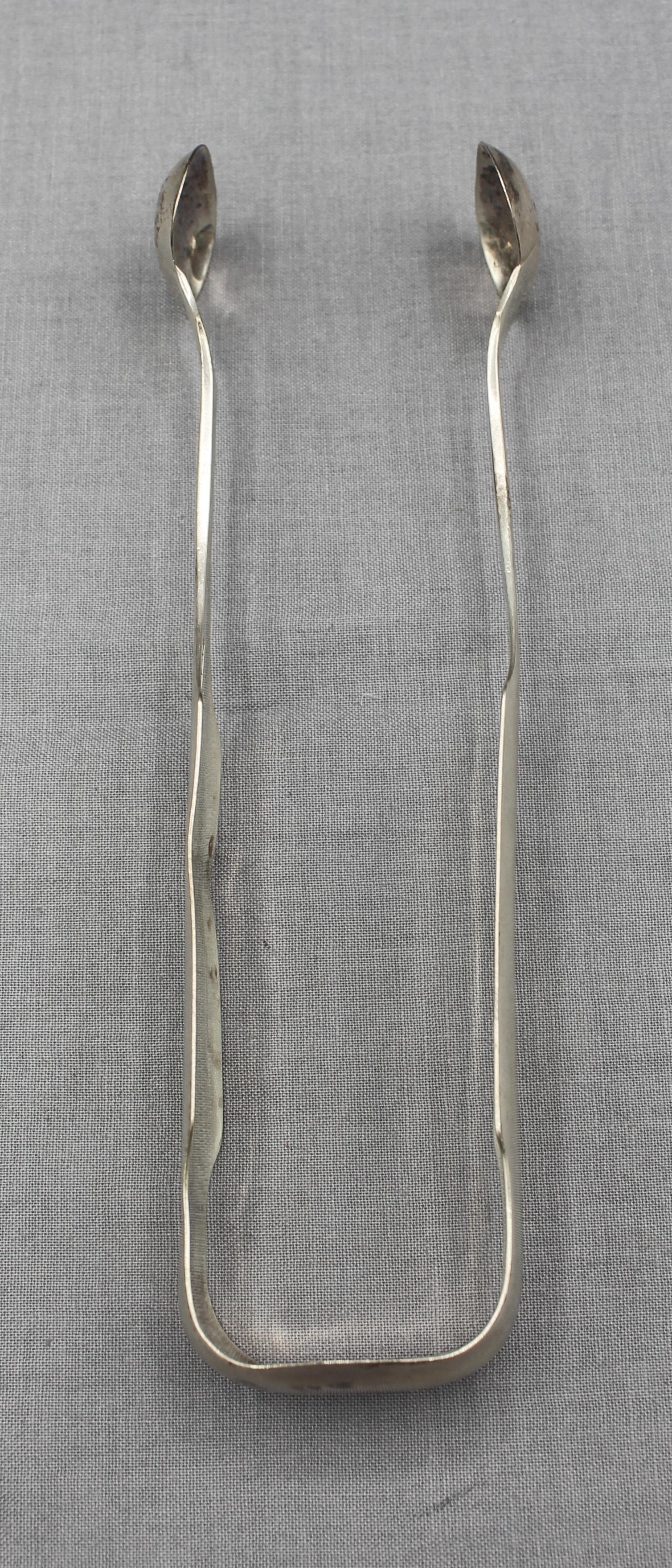 Coin silver sugar tongs by Robert Keyworth, Washington, DC, 1830-33. Silver from our capitol's early days is rare! Monogram: AEB. Minor edge bend. 1.30 troy oz.
6.25